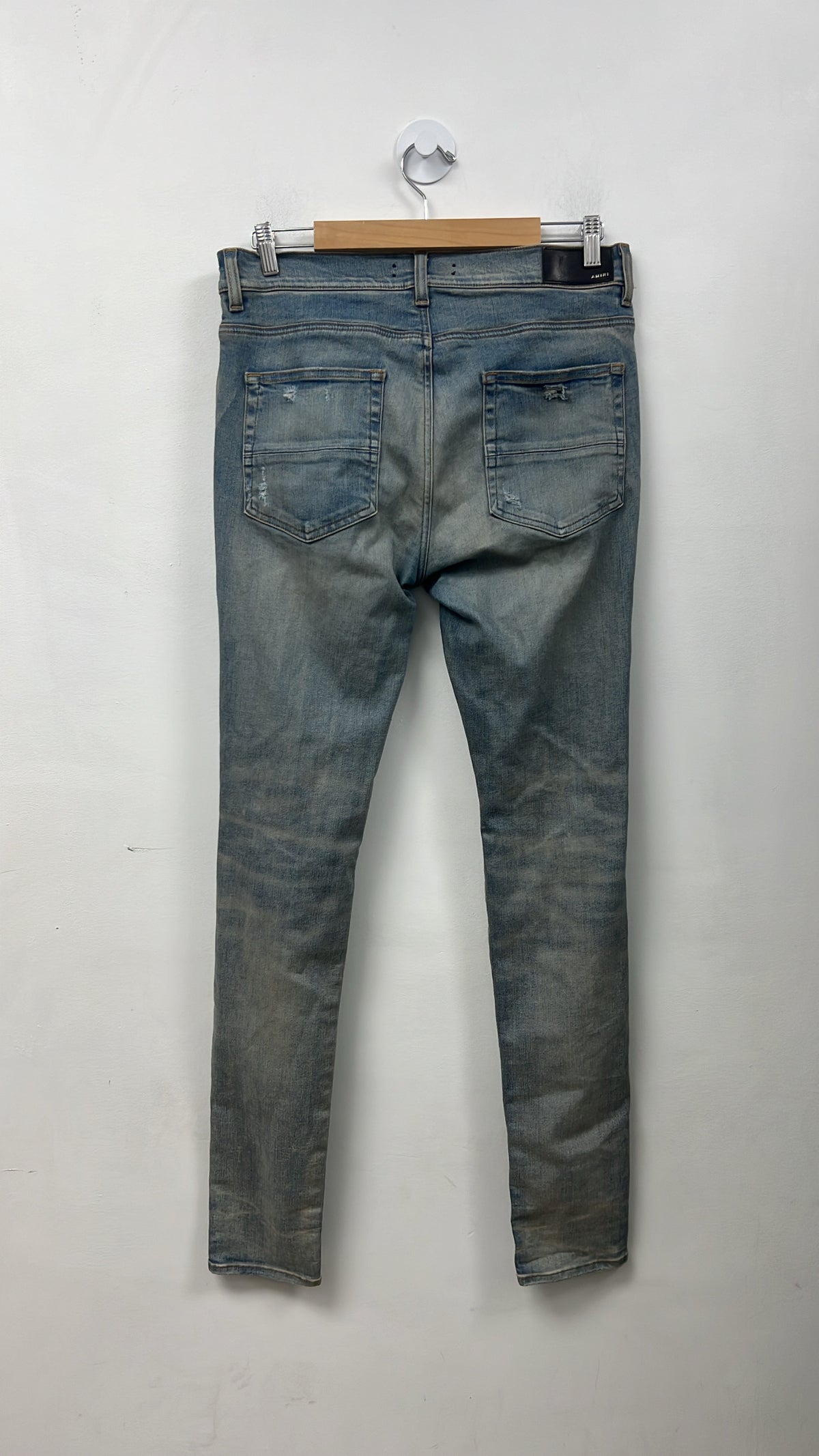 Amiri Light Wash Ripped Thrasher Jeans