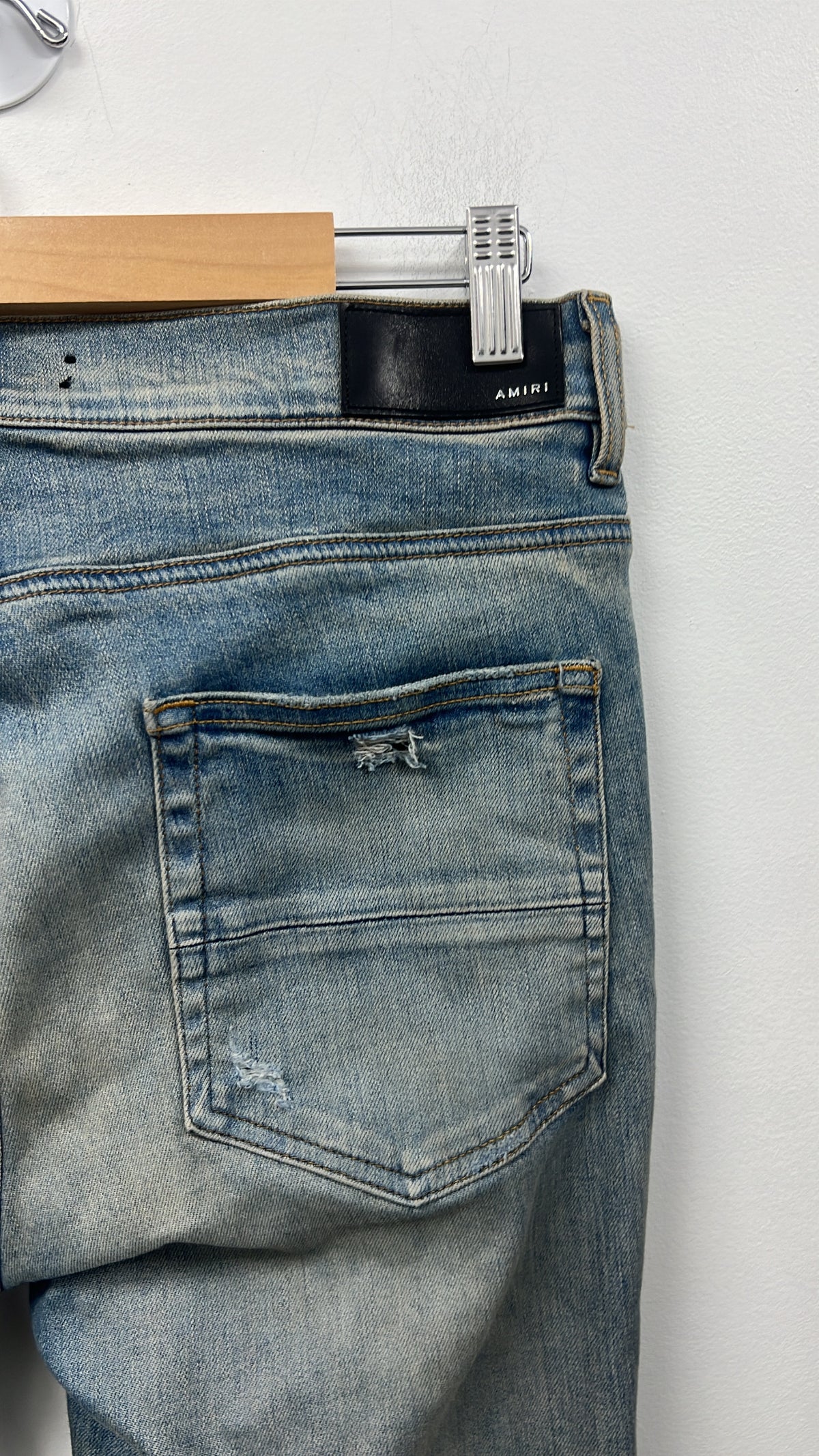 Amiri Light Wash Ripped Thrasher Jeans