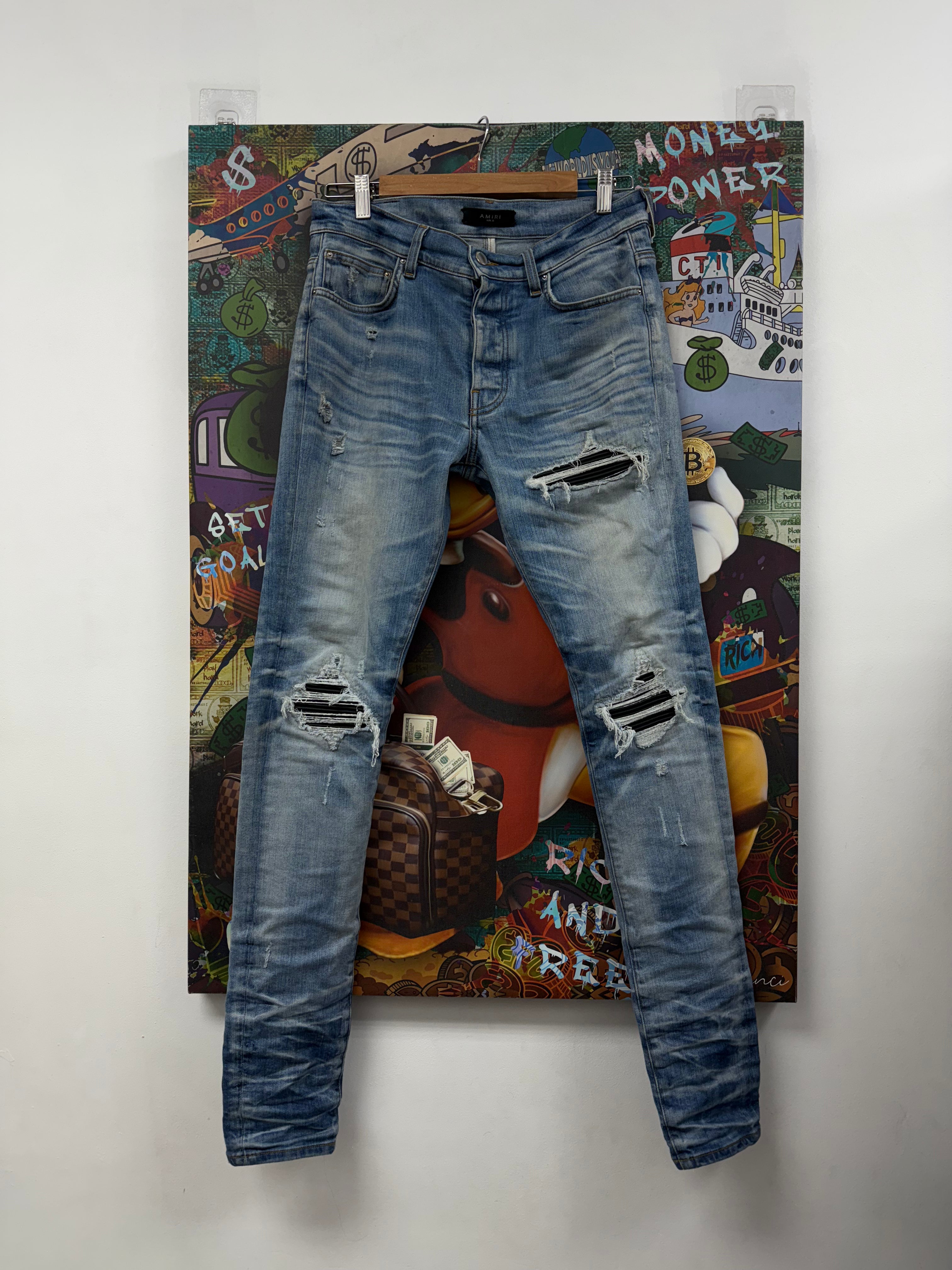 Amiri Light Wash Black Patch MX1 Jeans