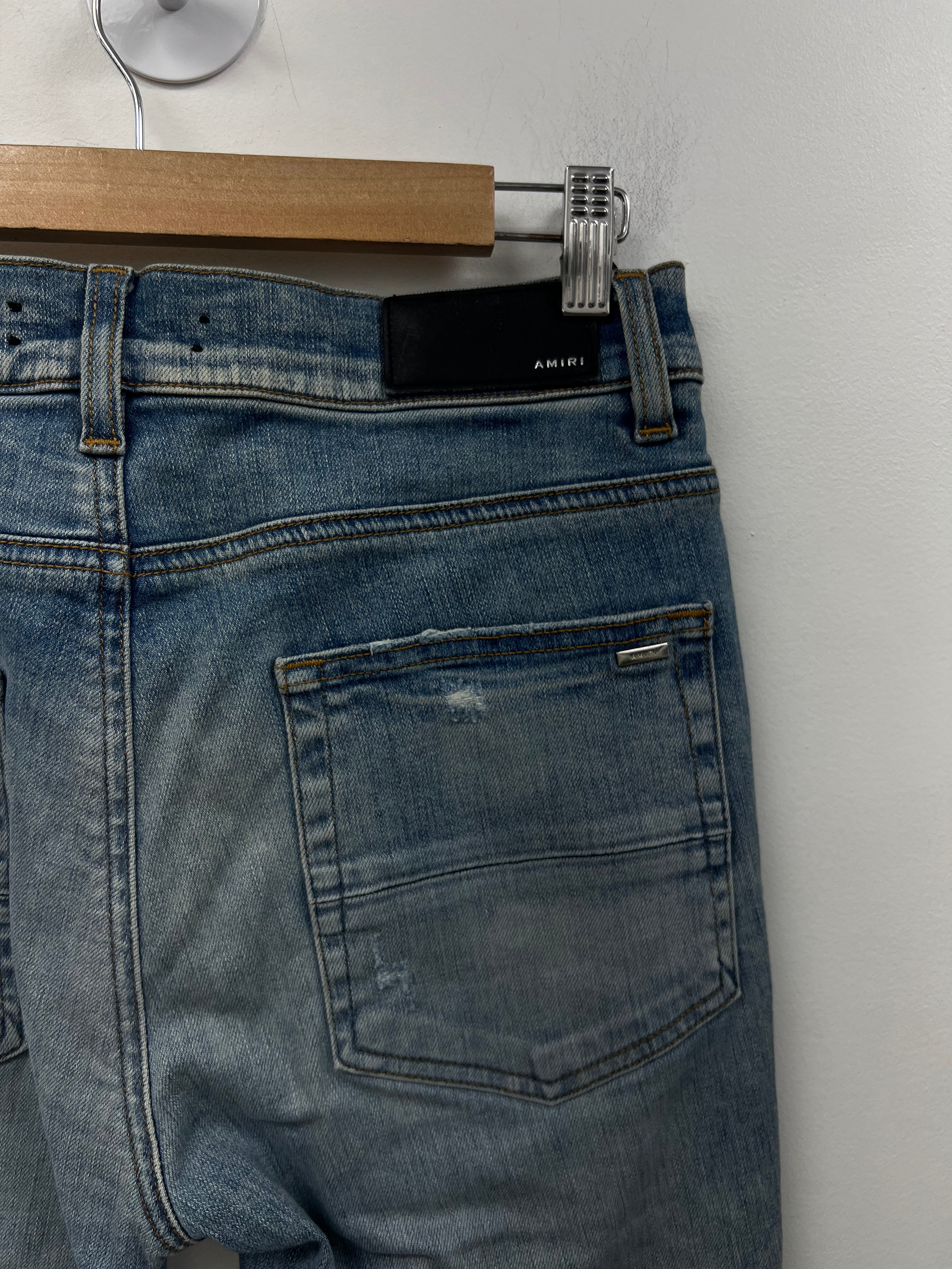 Amiri MX1 Light Wash Pink Crackle Patch Jeans