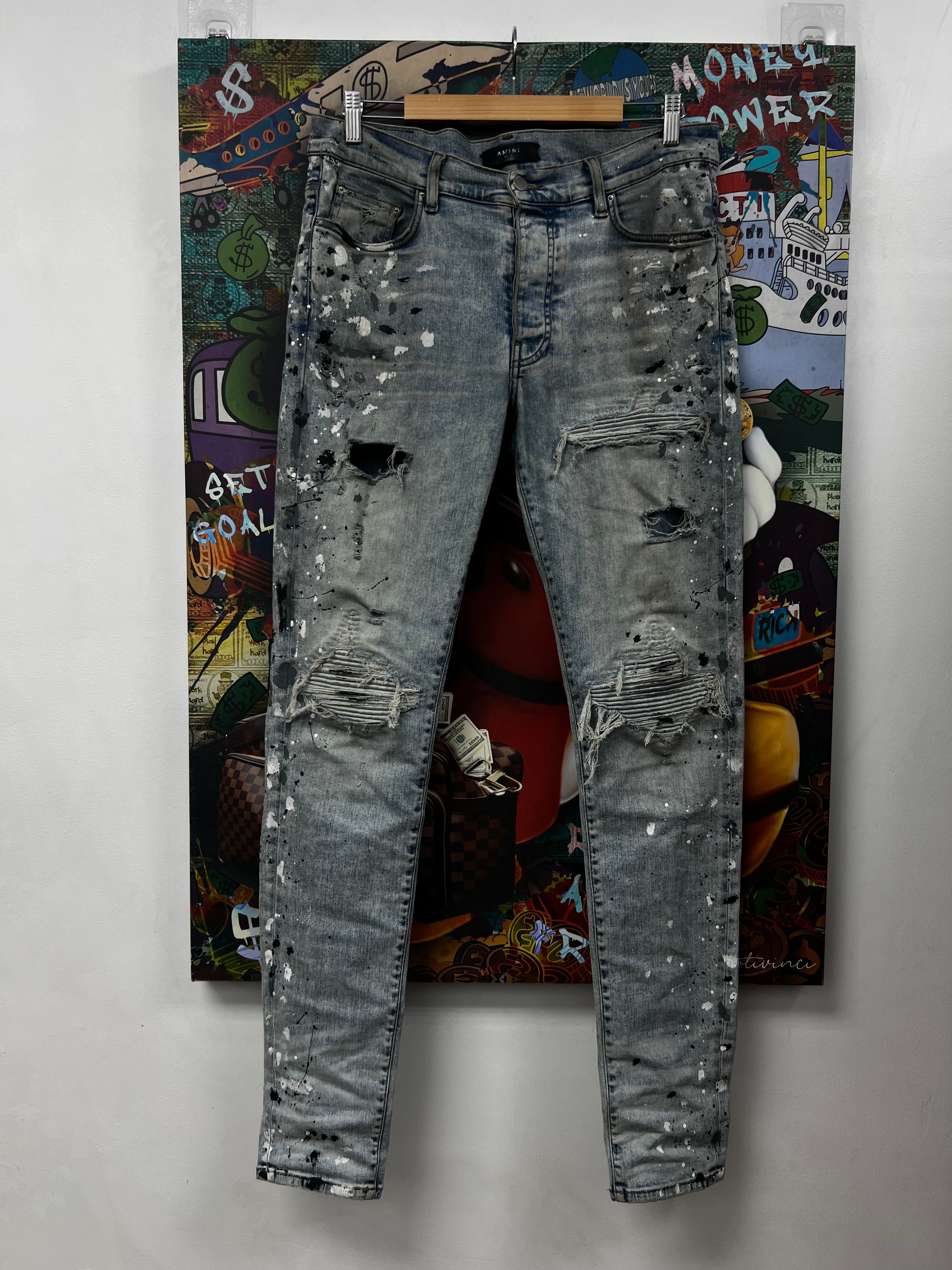 Amiri MX1 Light Wash Denim Paint Splatter Jeans