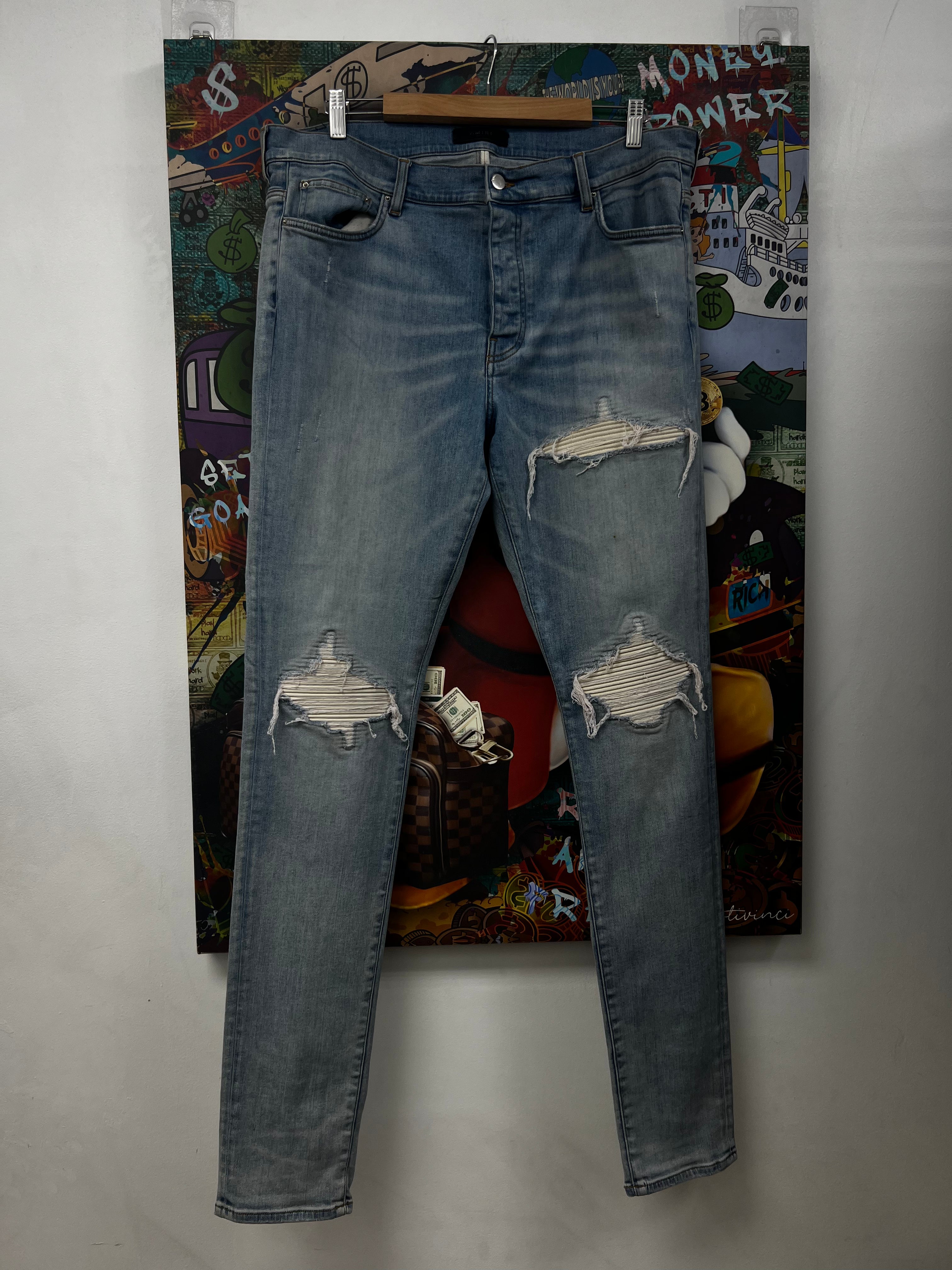 Amiri MX1 Light Wash White Patch Jeans