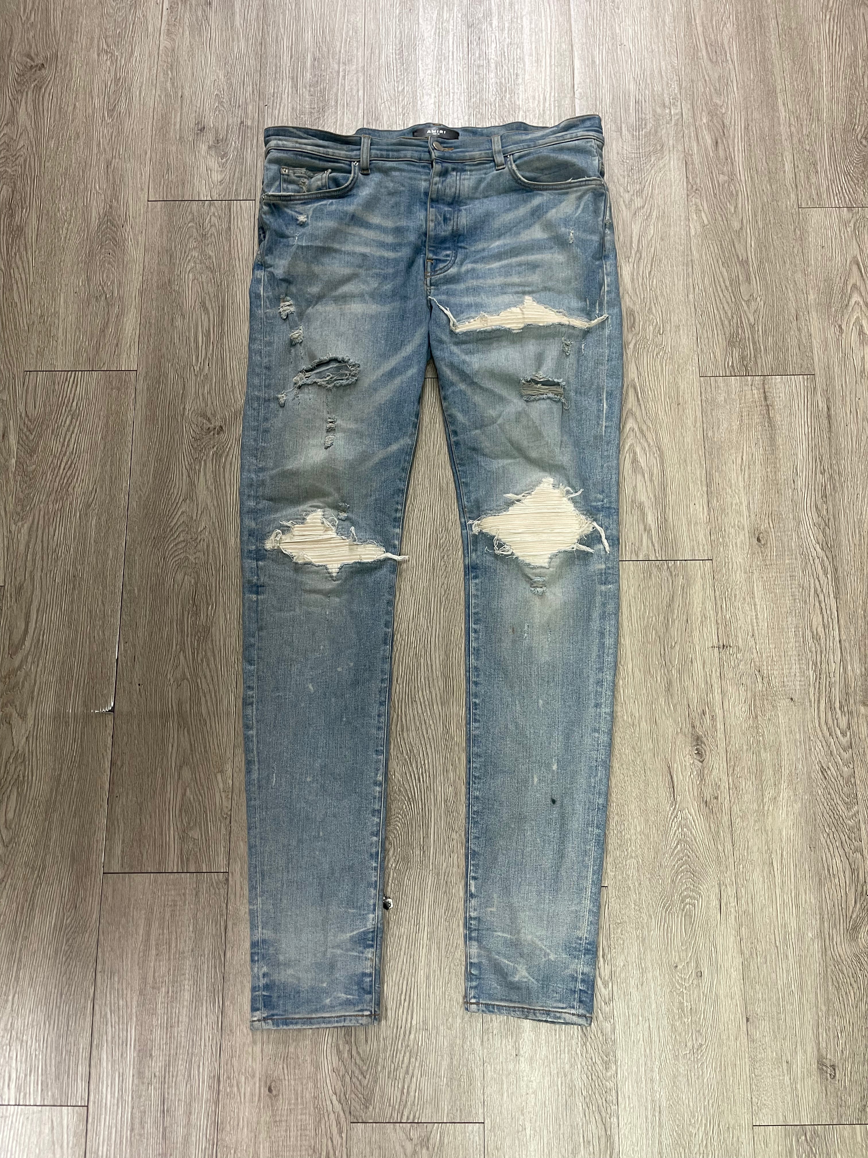 Amiri MX1 Light Wash White Patch Jeans