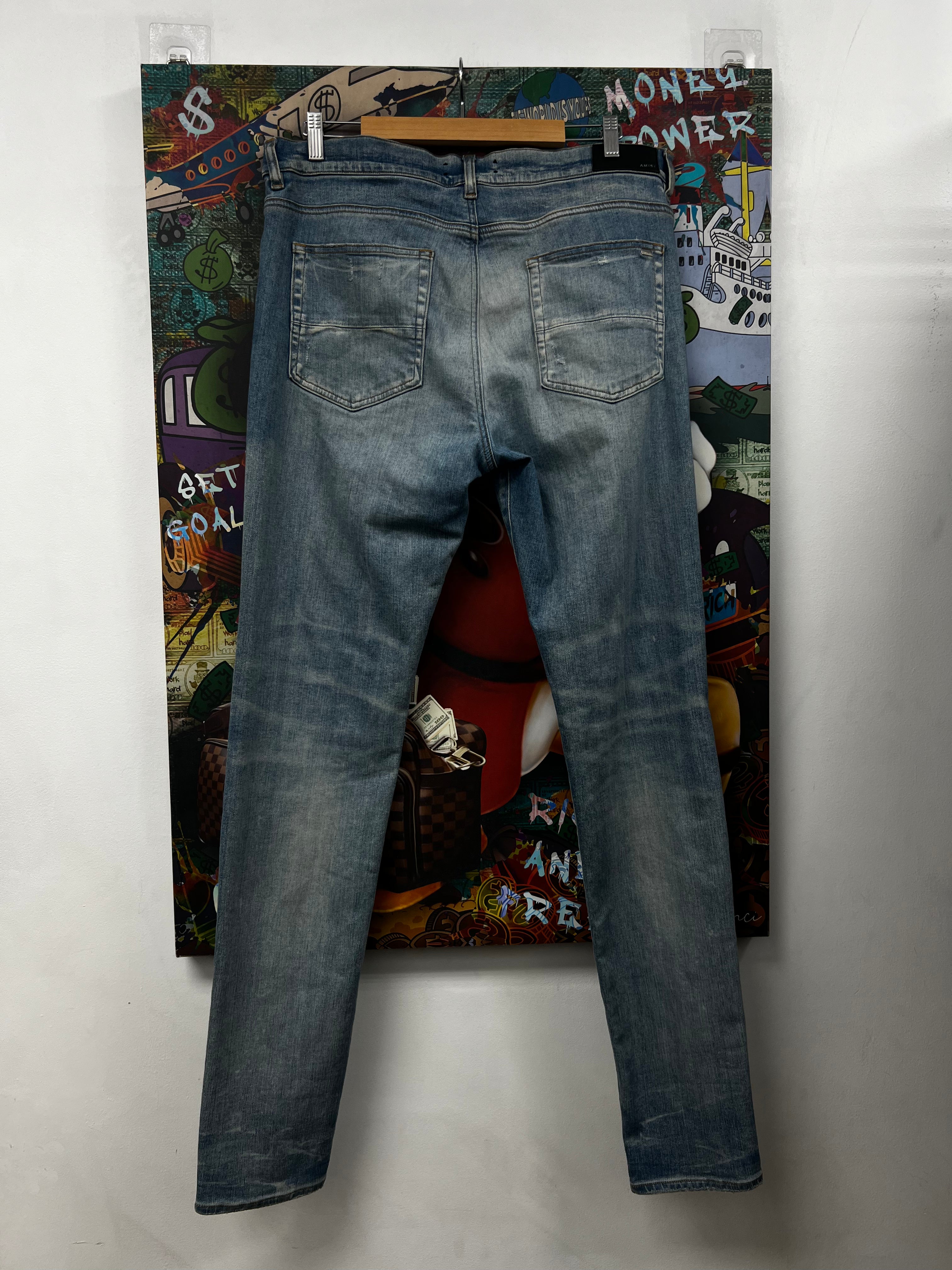 Amiri MX1 Light Wash White Patch Jeans
