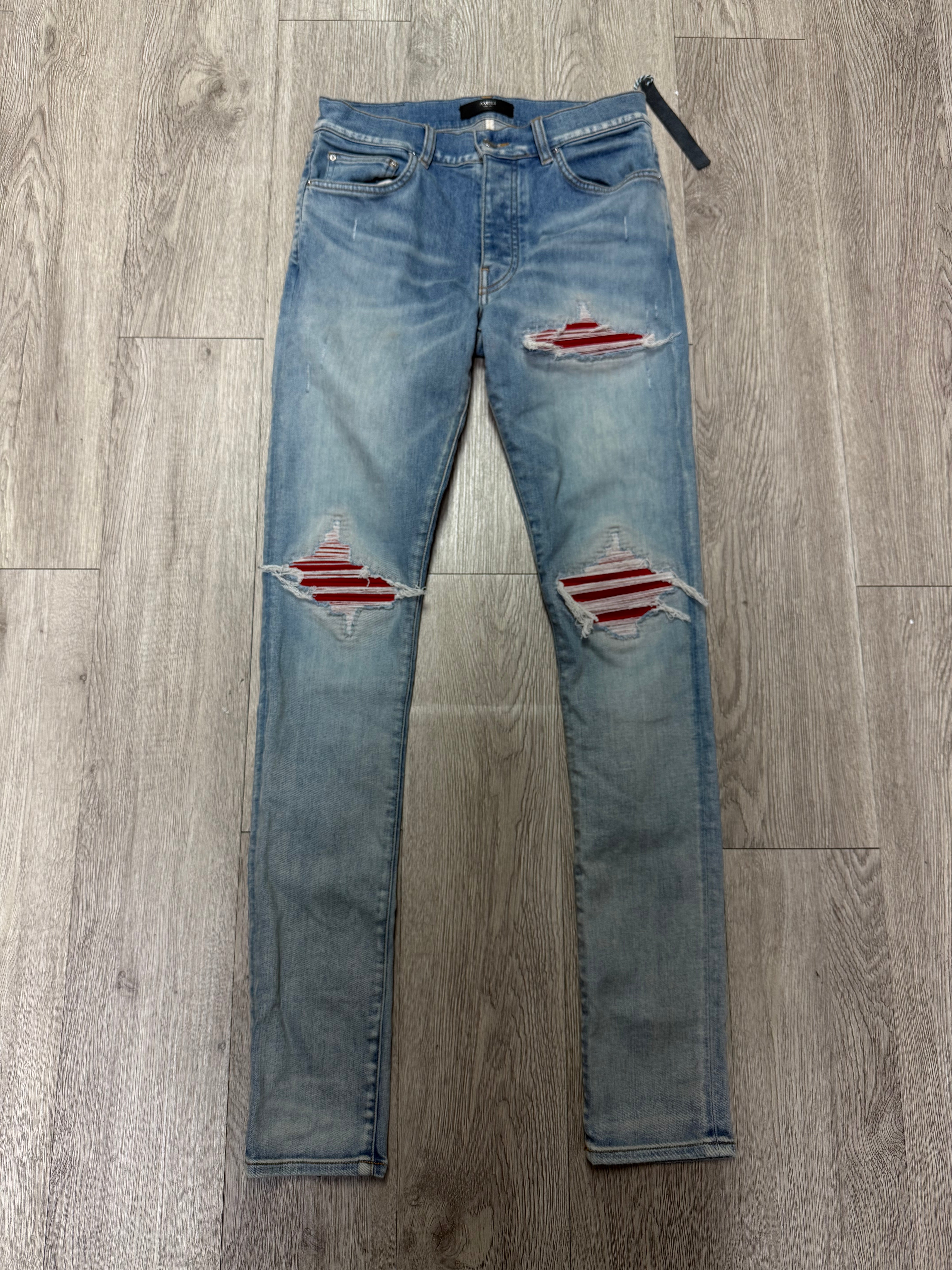 Amiri MX1 Light Wash Red Suede Patch Jeans