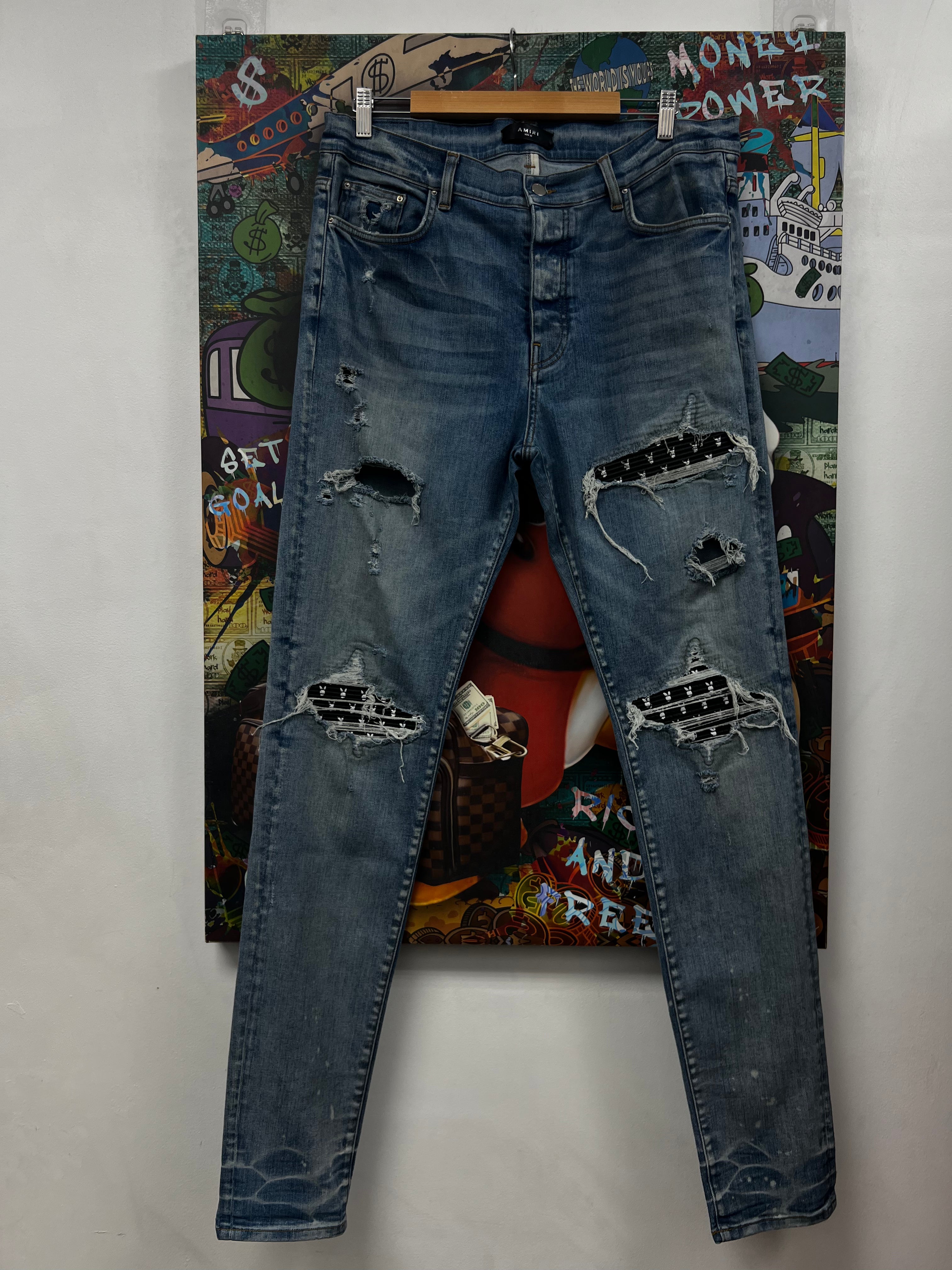 Amiri MX1 Light Wash Black Playboy Patch Jeans