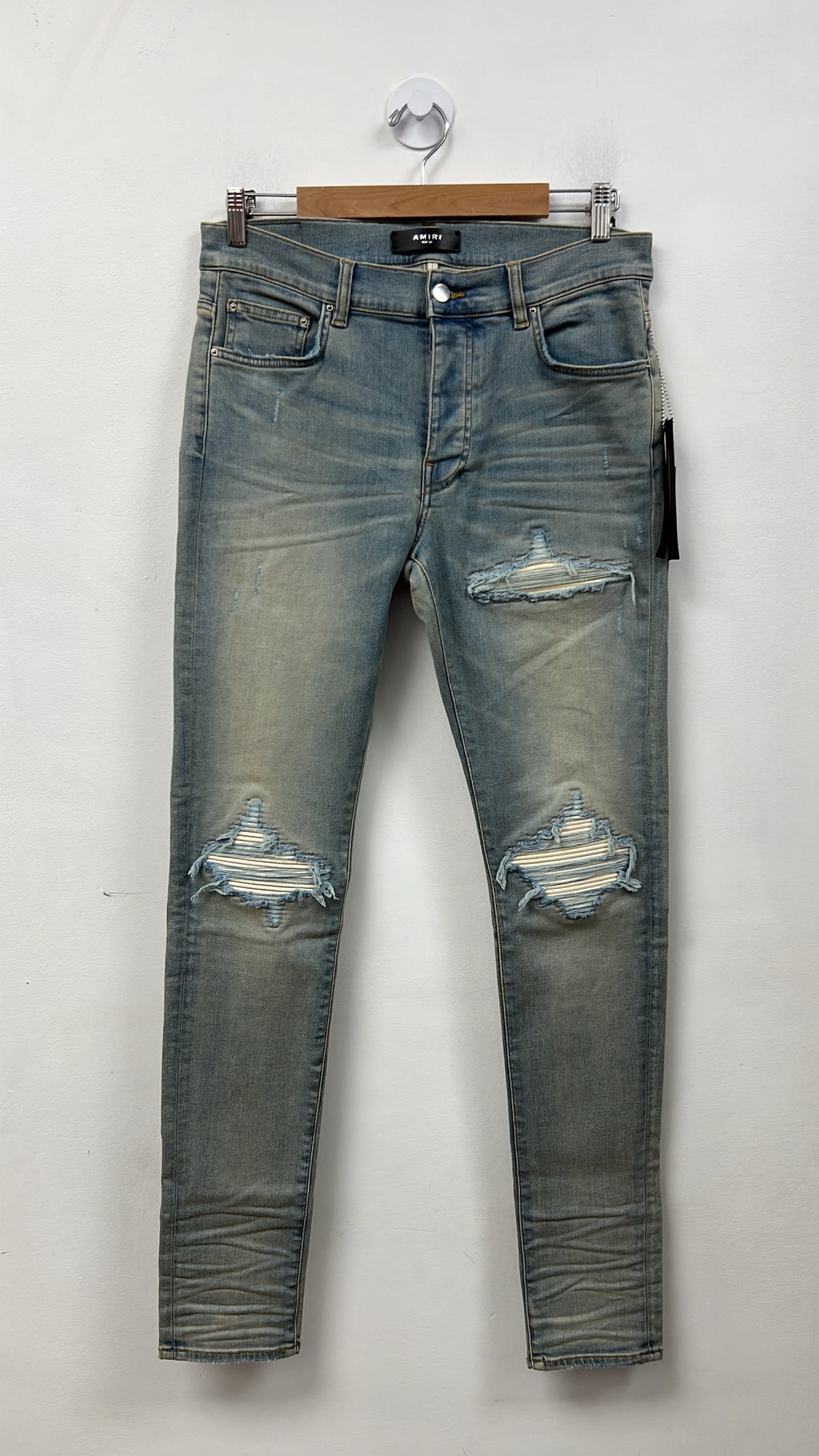 Amiri MX1 Light Wash White Patch Jeans