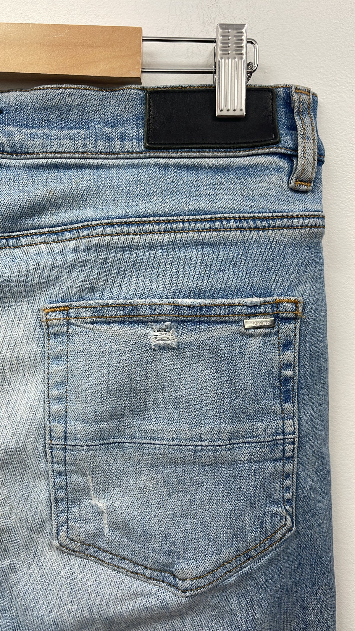 Amiri MX1 Light Wash White Patch Jeans