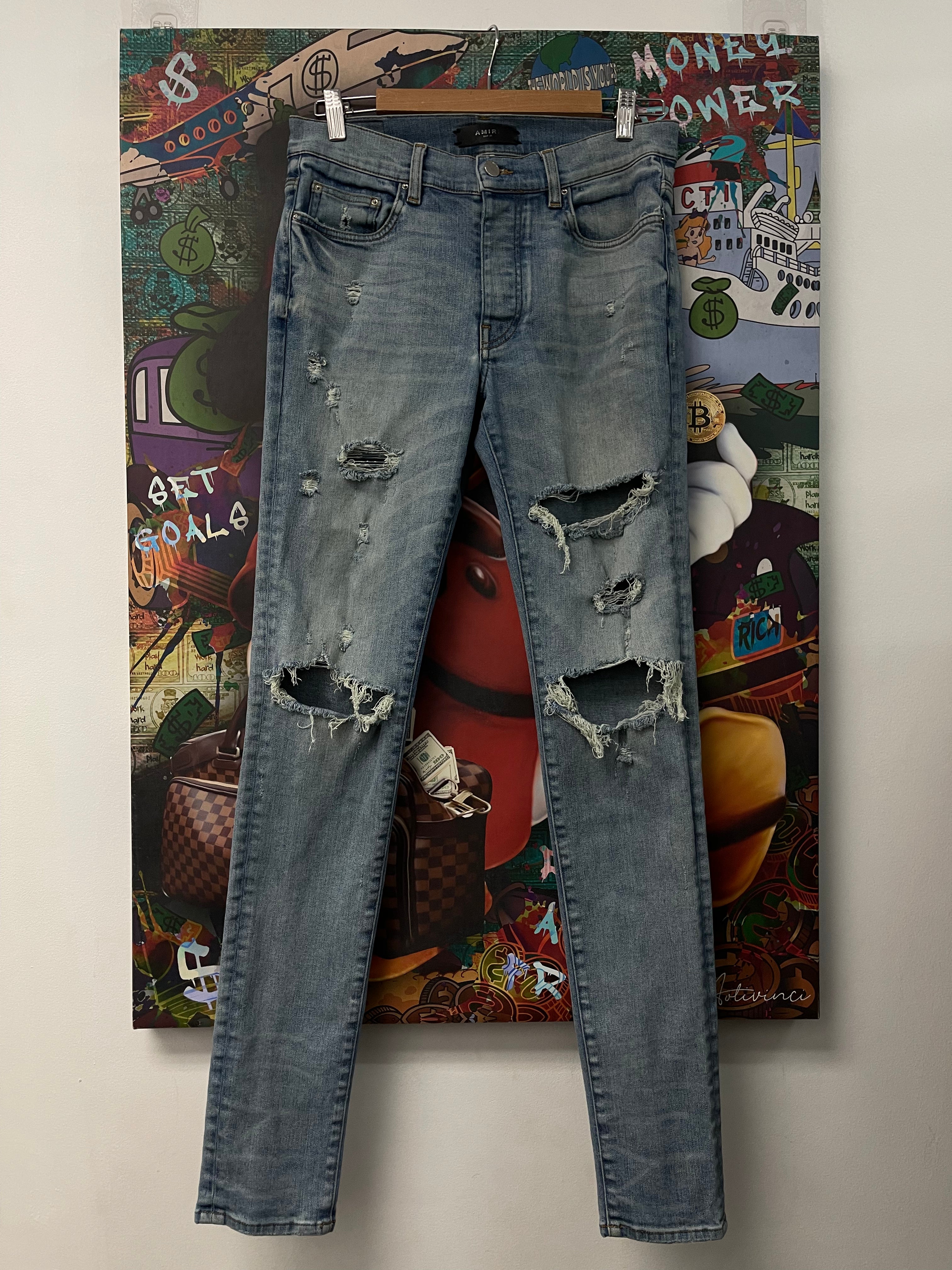 Amiri Light Wash Ripped Thrasher Jeans