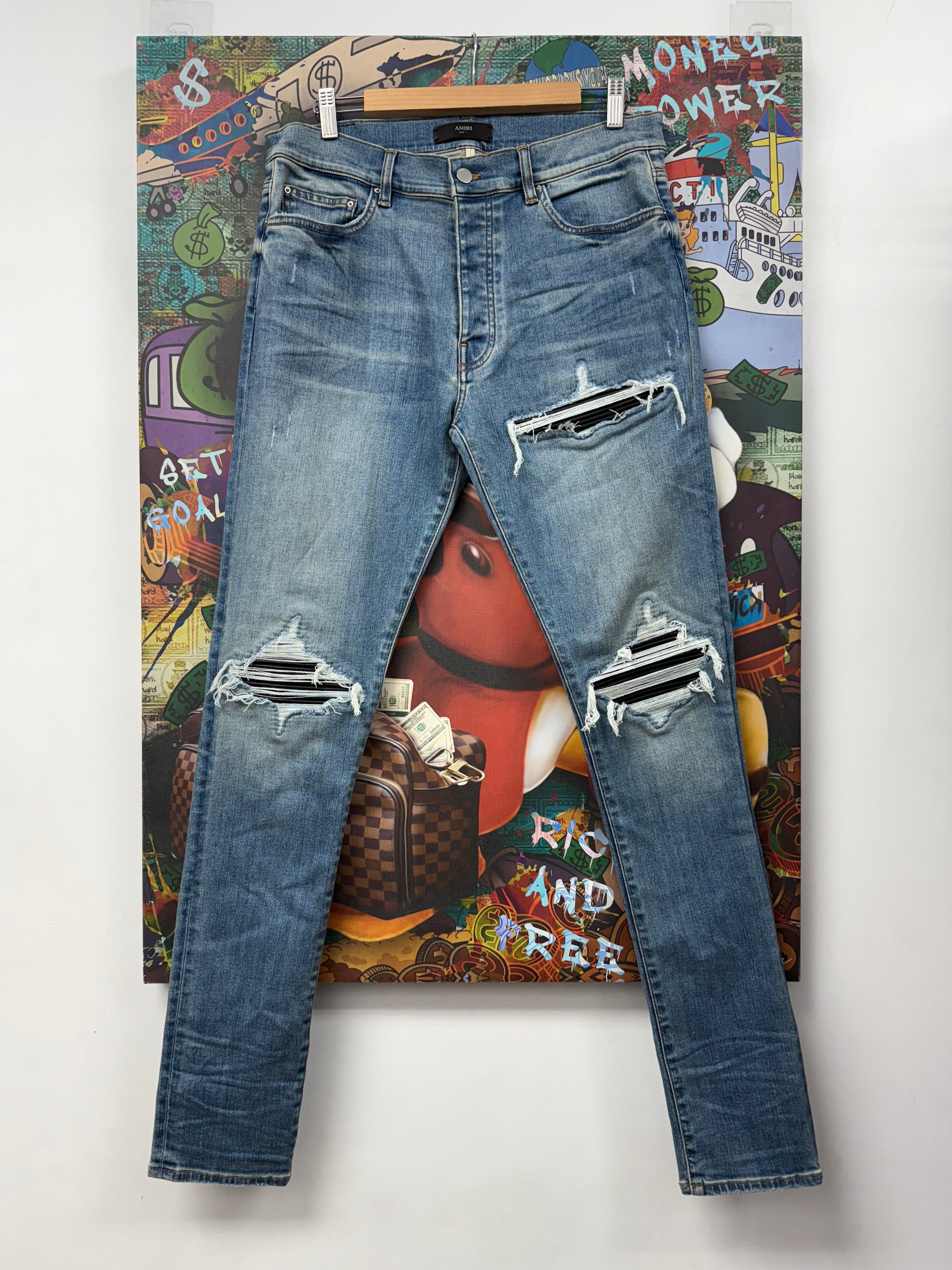 Amiri MX1 Light Wash Black Patch Jeans