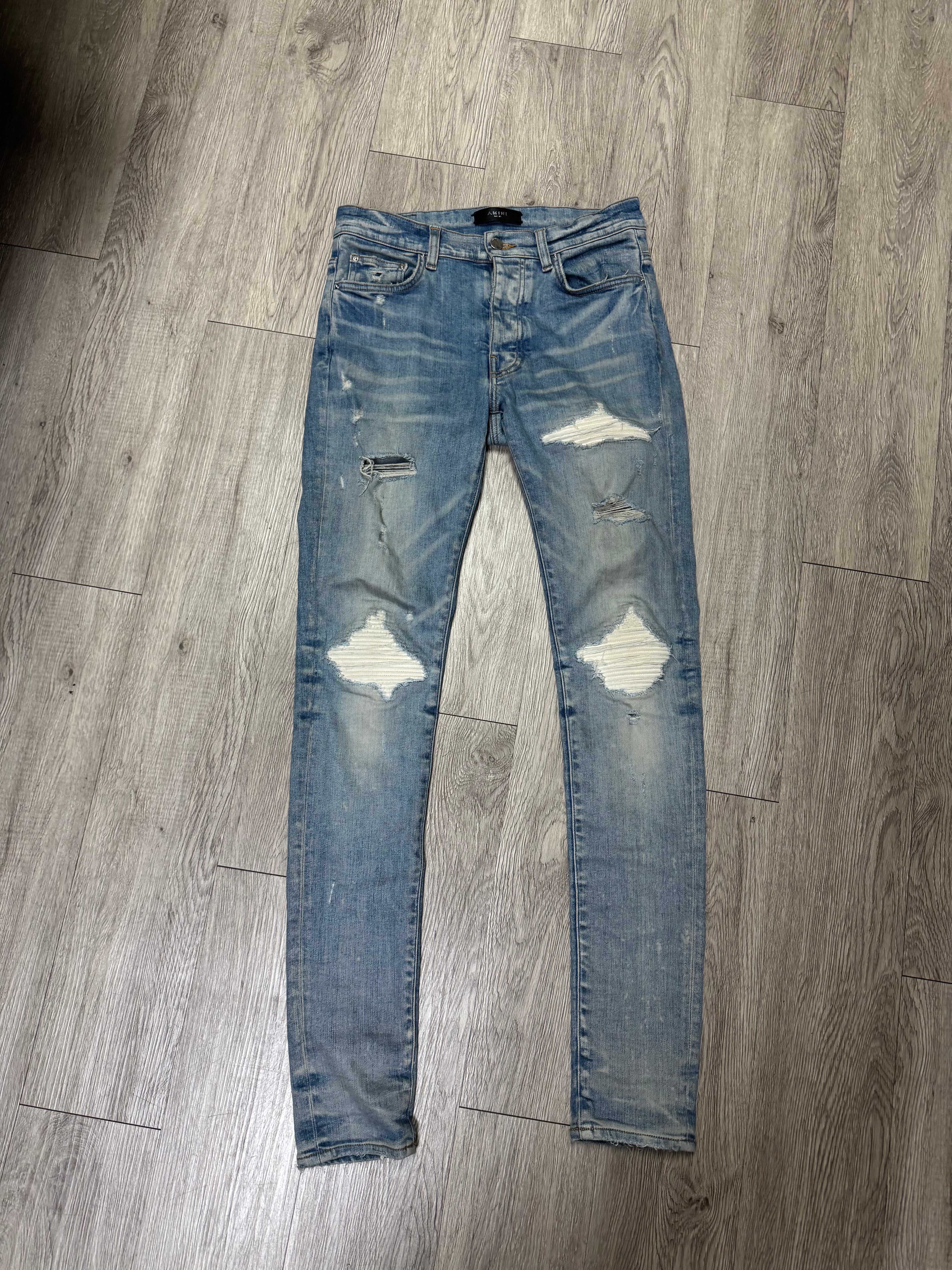 Amiri MX1 Light Wash White Patch Jeans