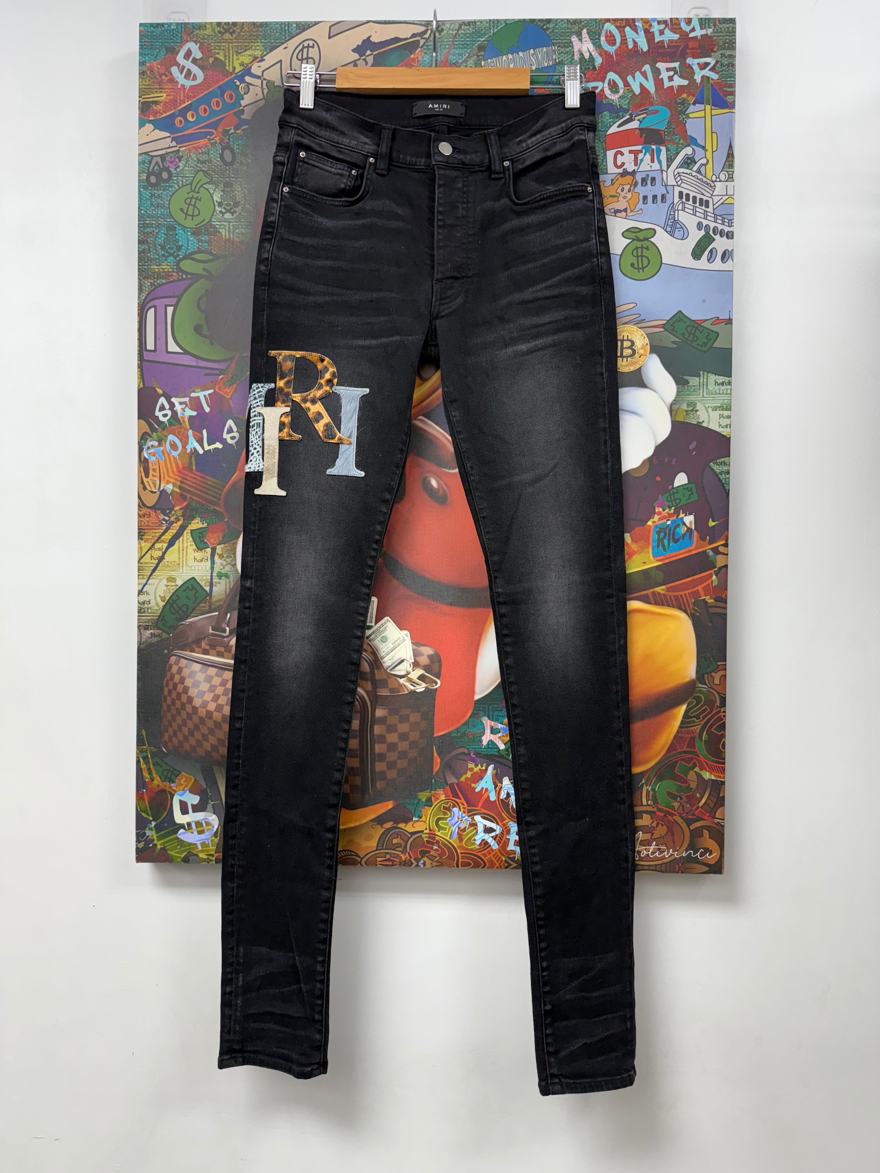 Amiri Black Wash Multi Staggered Side Logo Jeans