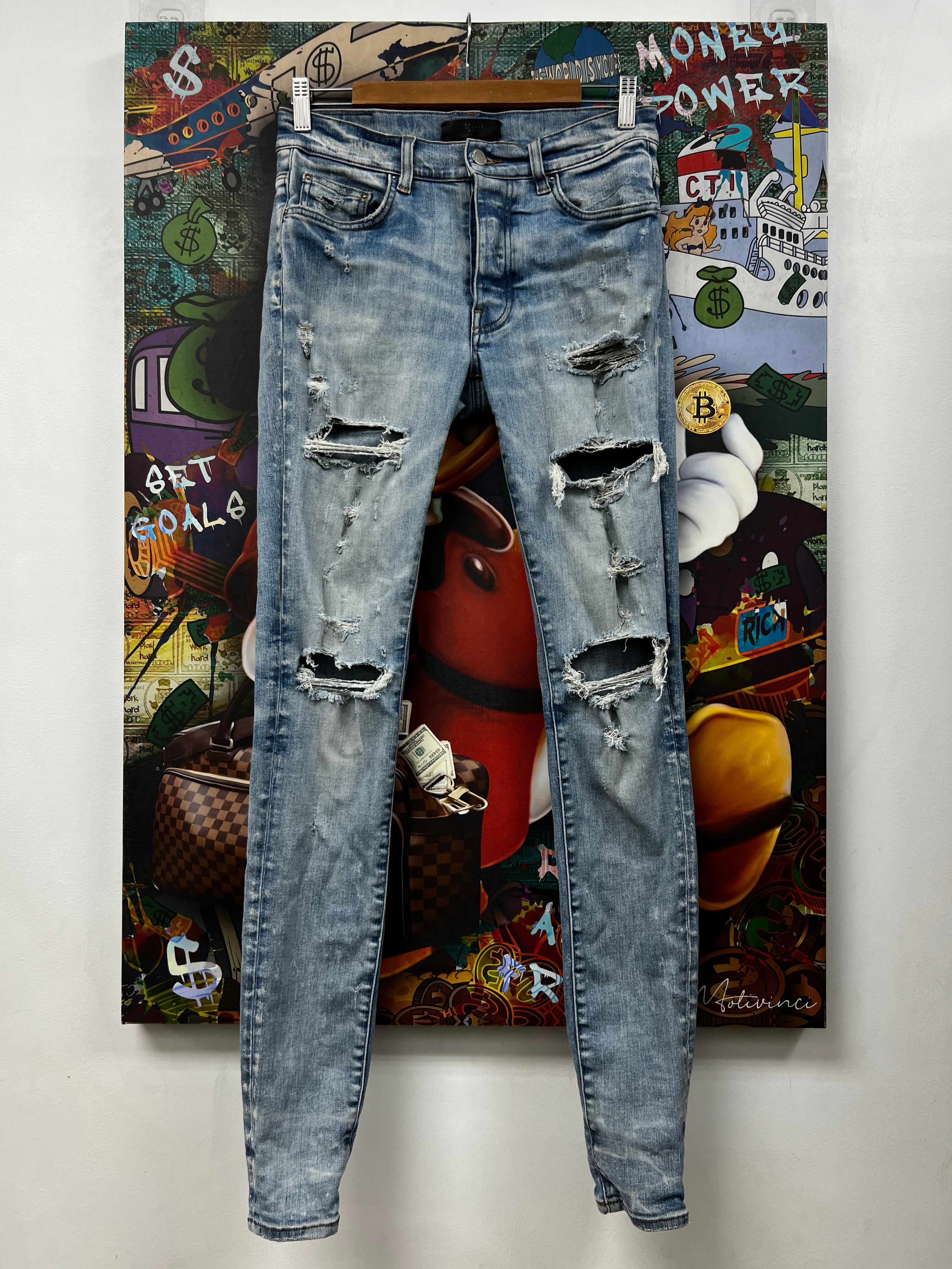 Amiri Light Wash Ripped Thrasher Jeans