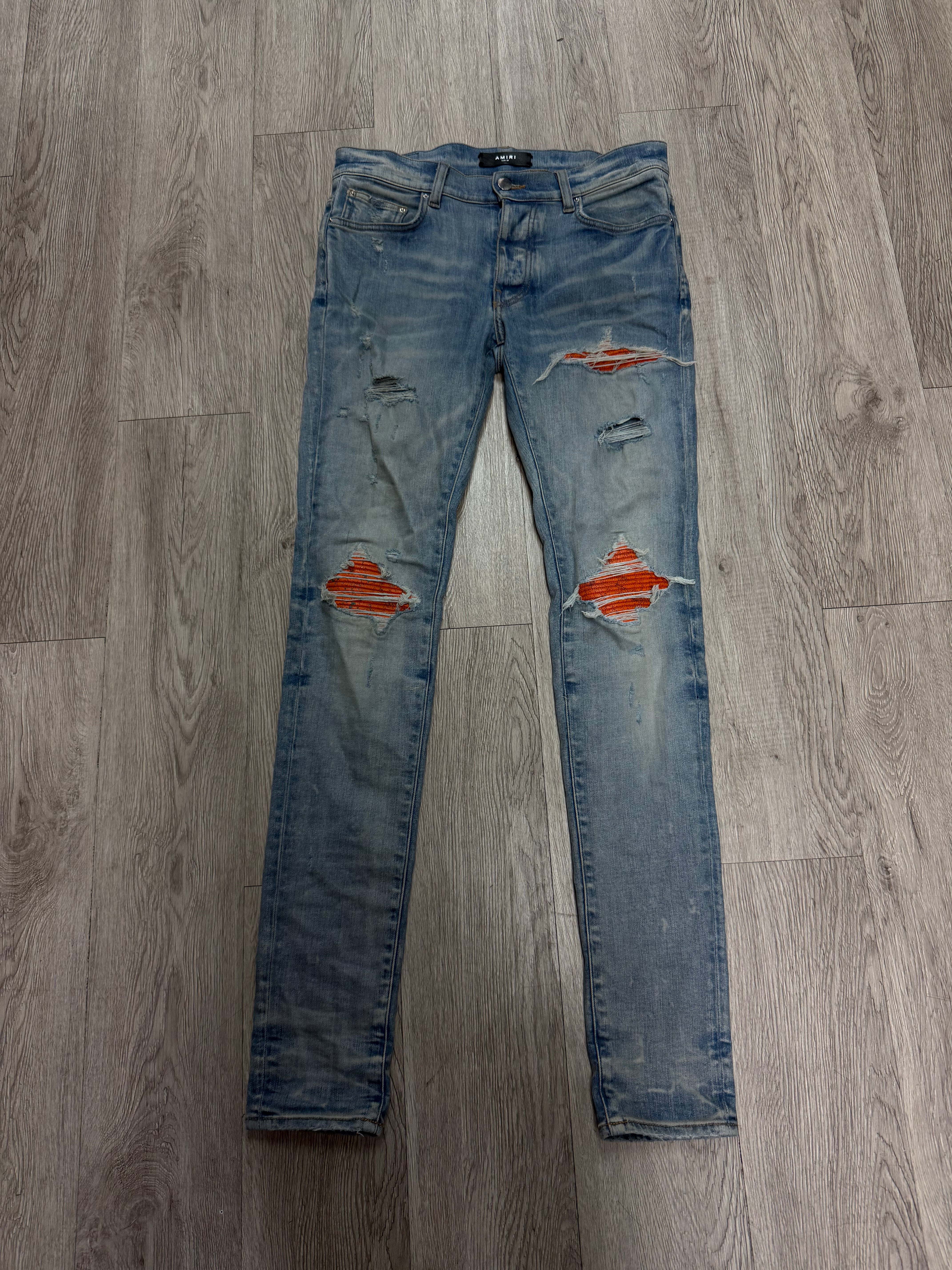 Amiri MX1 Light Wash Orange Crackle Patch Jeans