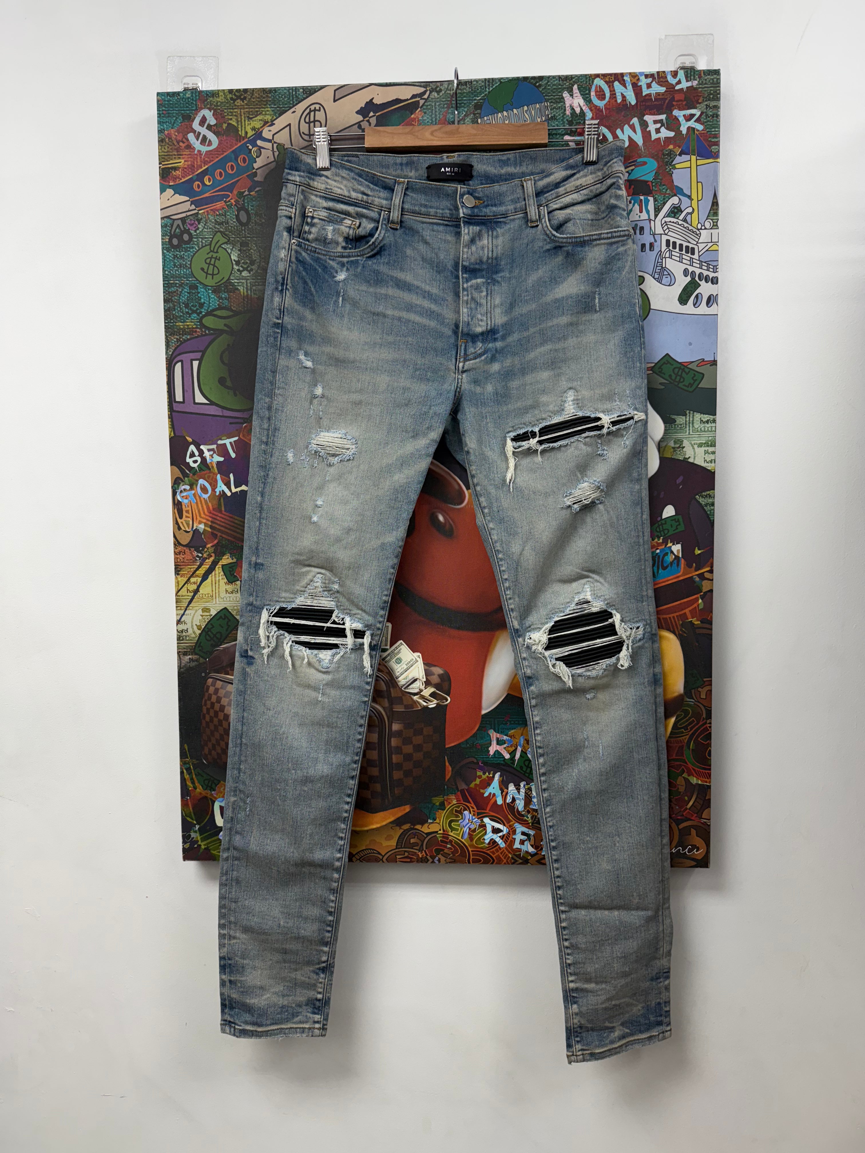 Amiri MX1 Light Wash Black Leather Patch Jeans