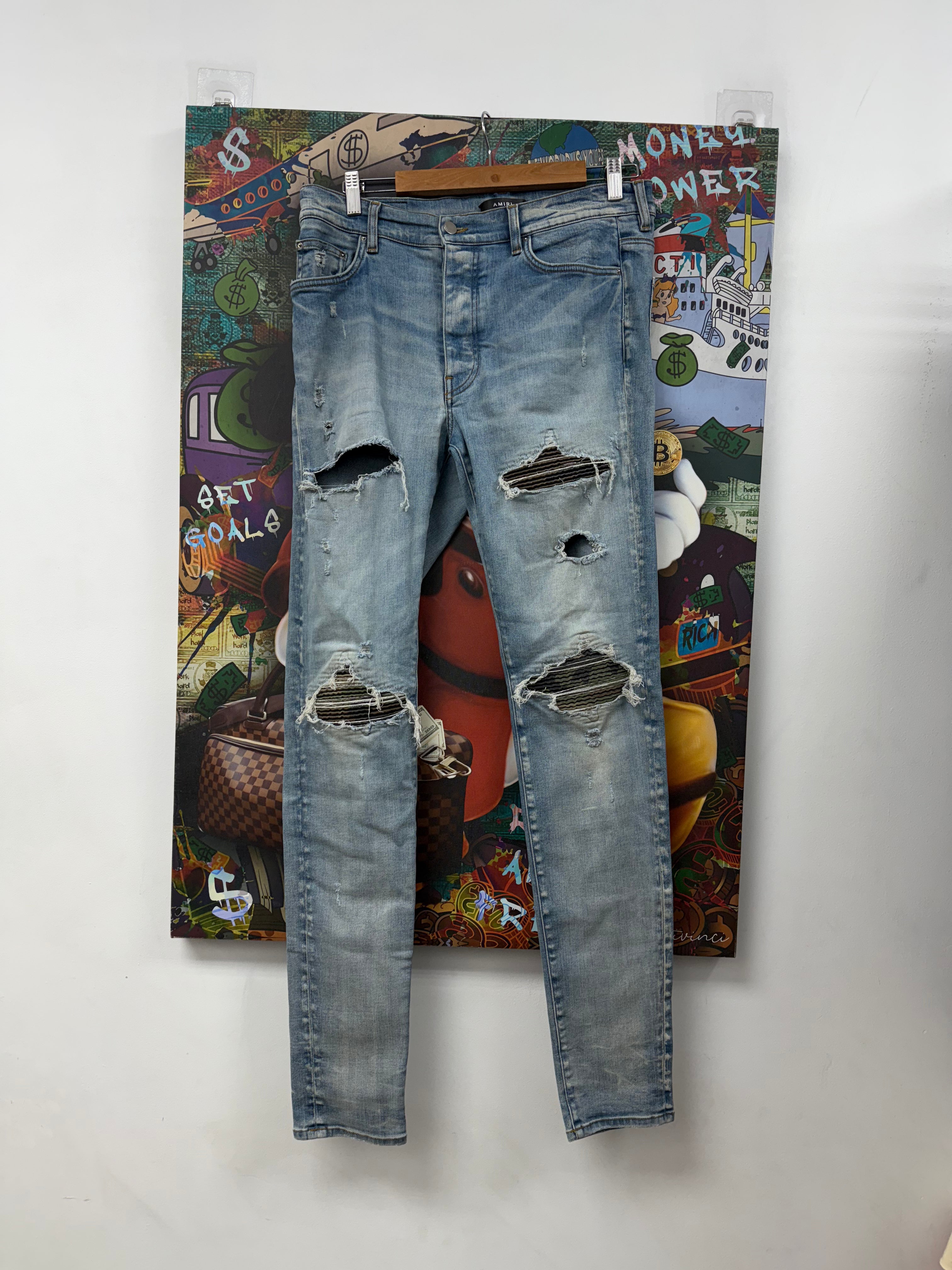 Amiri MX1 Light Wash Camo Patch Jeans
