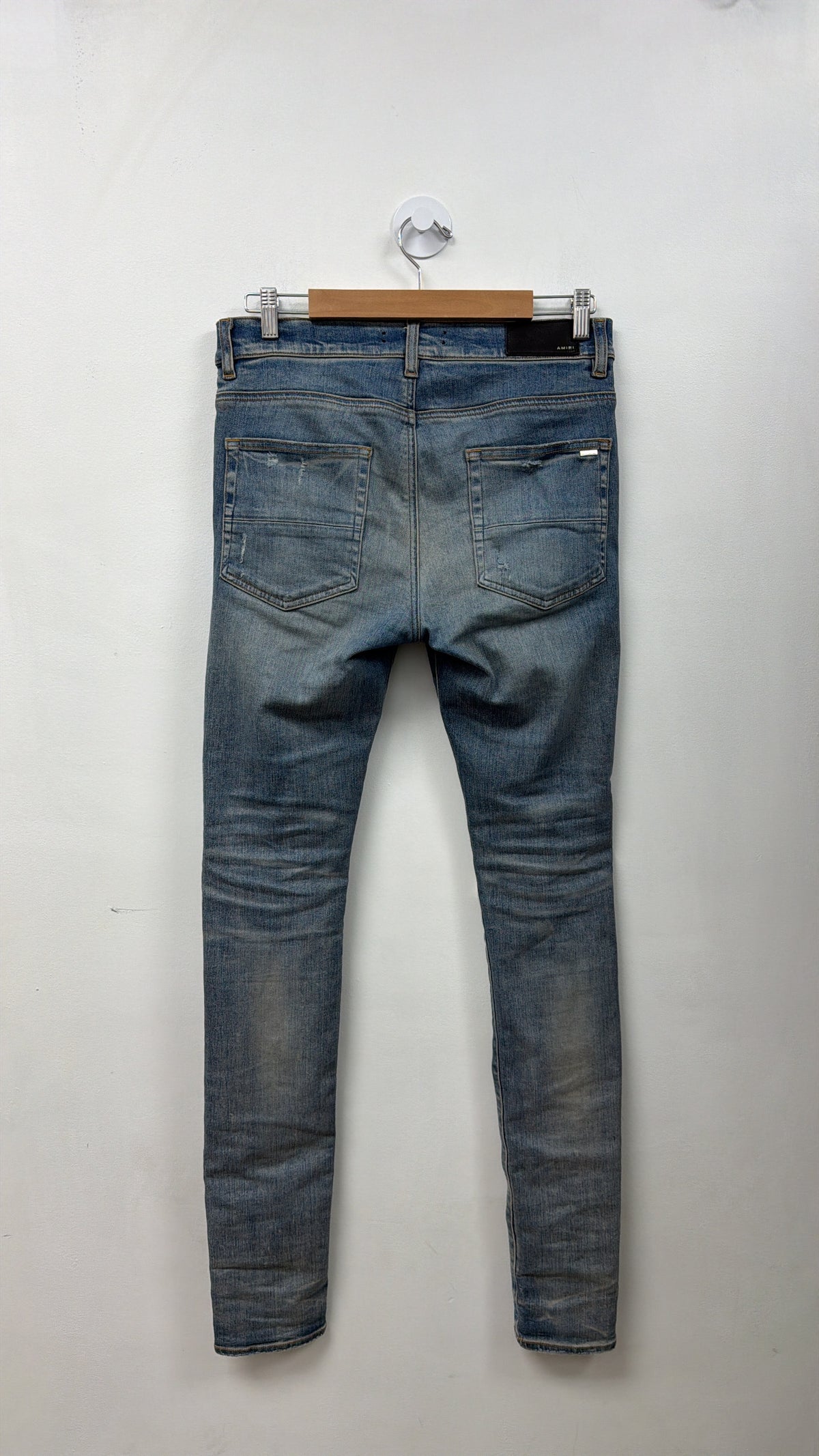Amiri Light Wash Blue Tie Dye Thrasher Patch Jeans