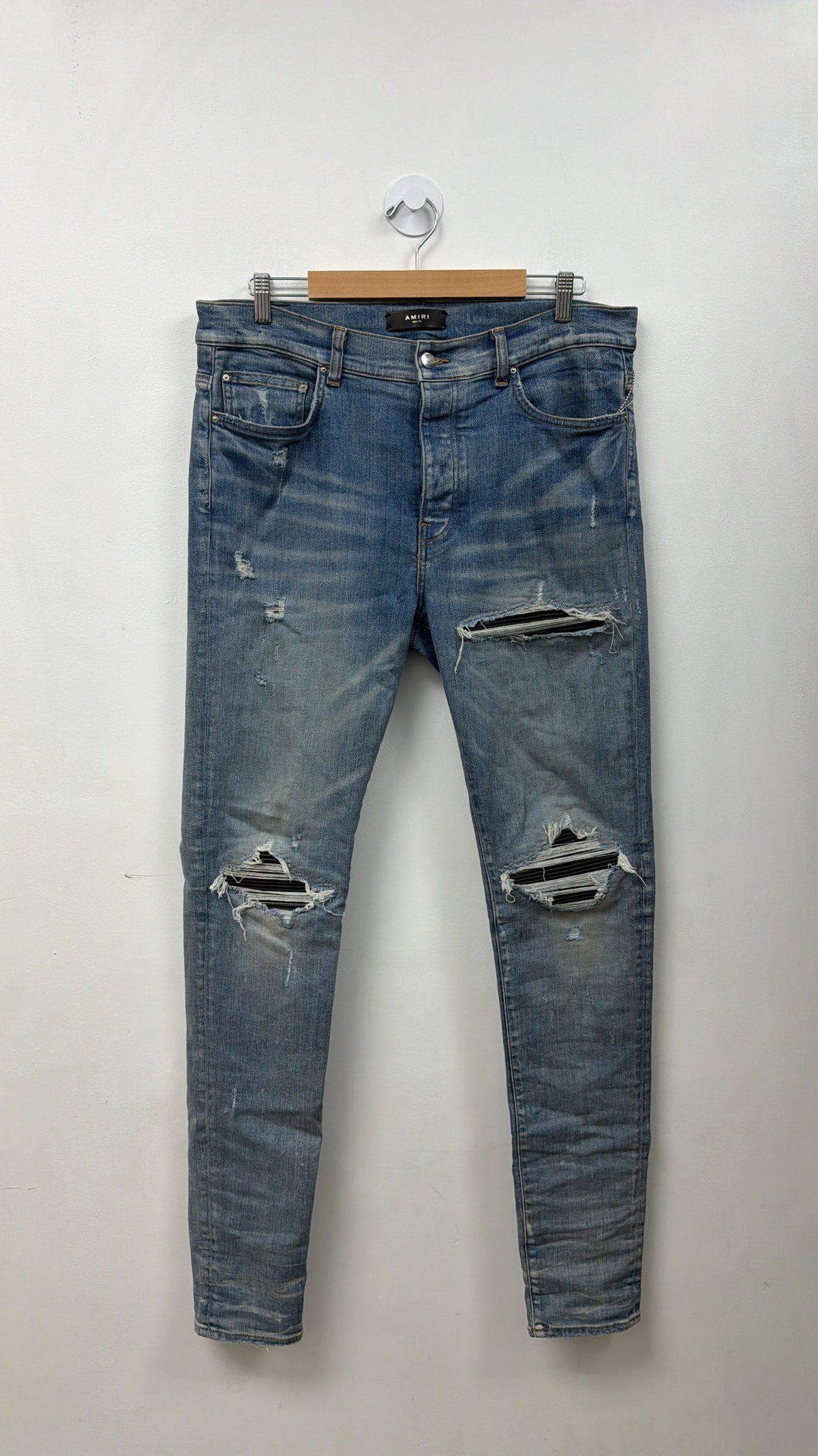 Amiri MX1 Light Wash Black Leather Patch Jeans