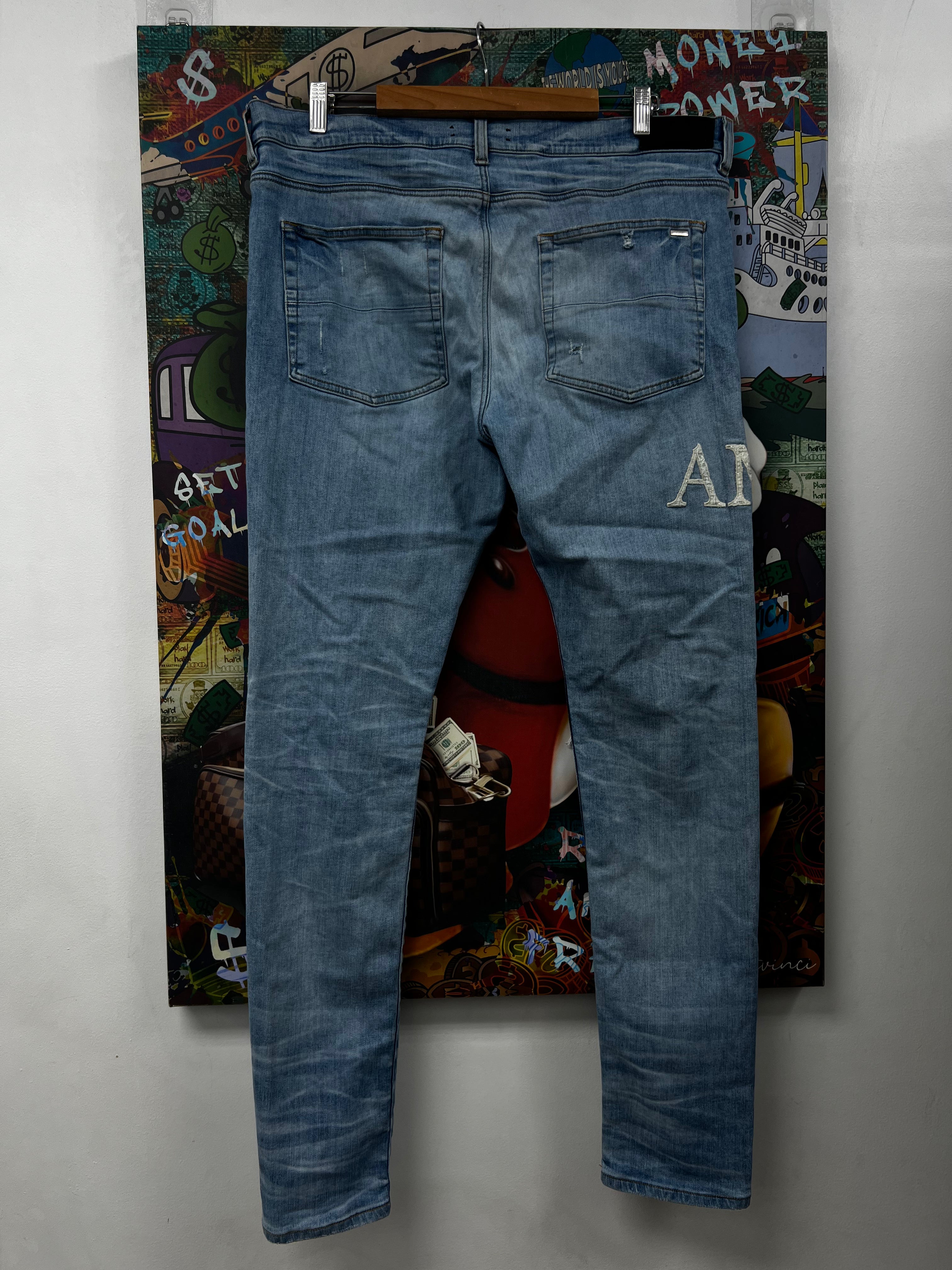 Amiri Light Wash Boucle Side Logo Jeans