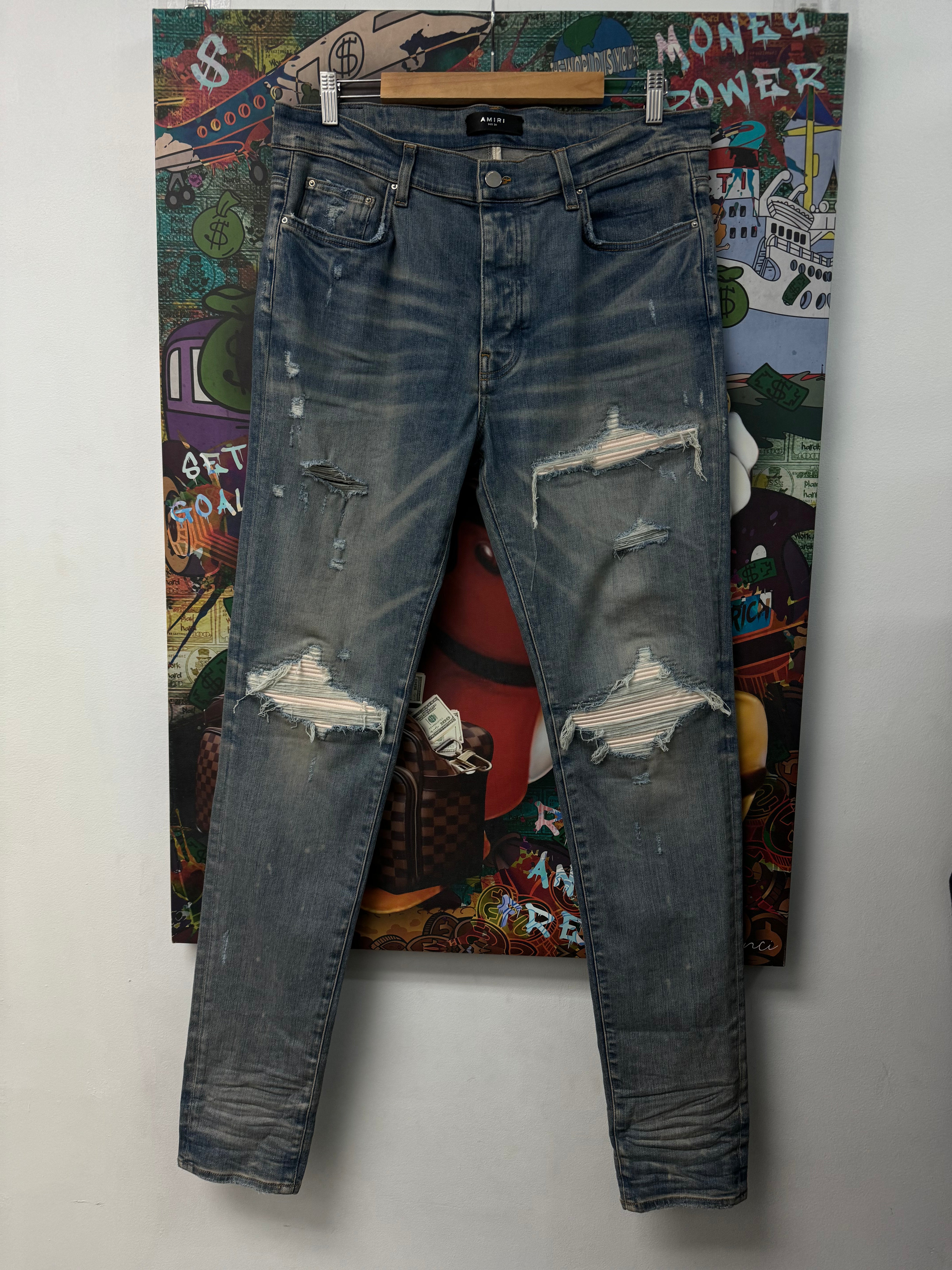 Amiri MX1 Light Wash White Patch Jeans