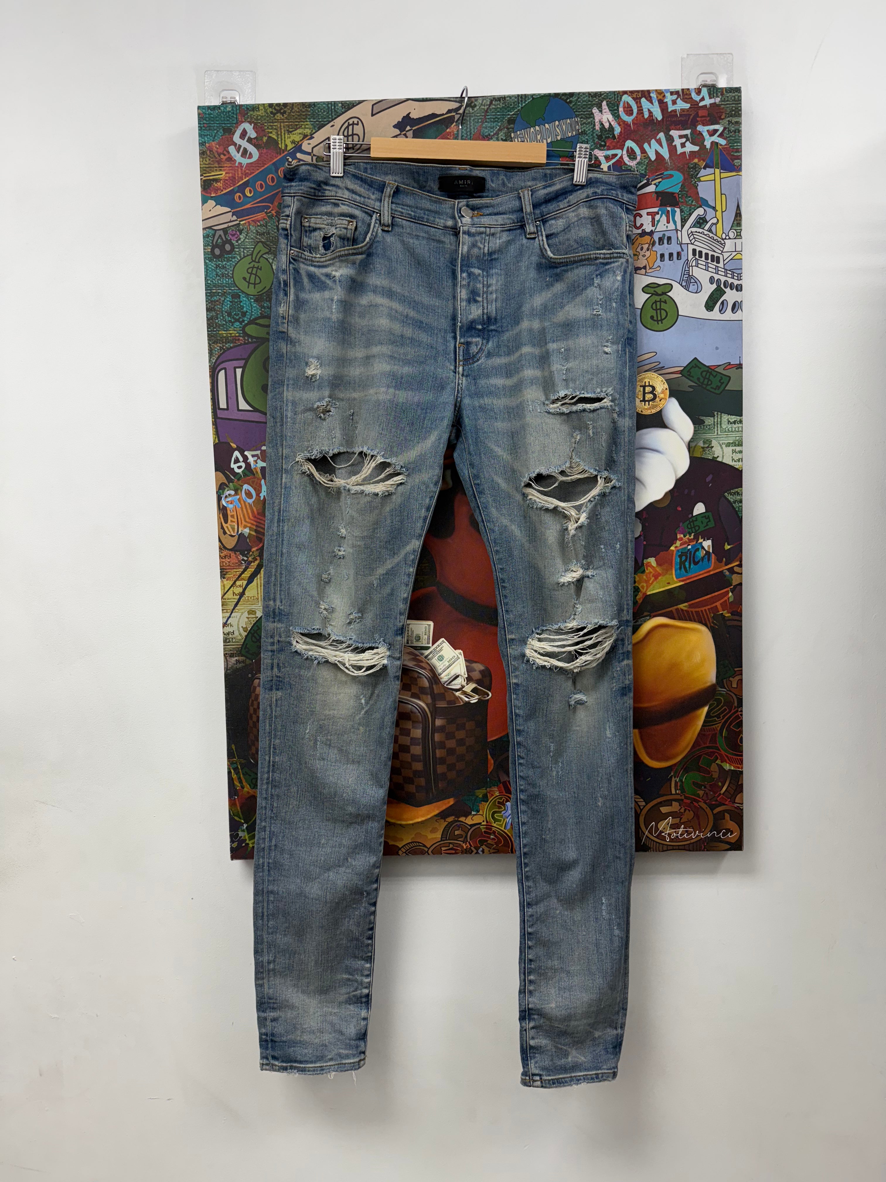 Amiri Light Wash Thrasher Rip Jeans