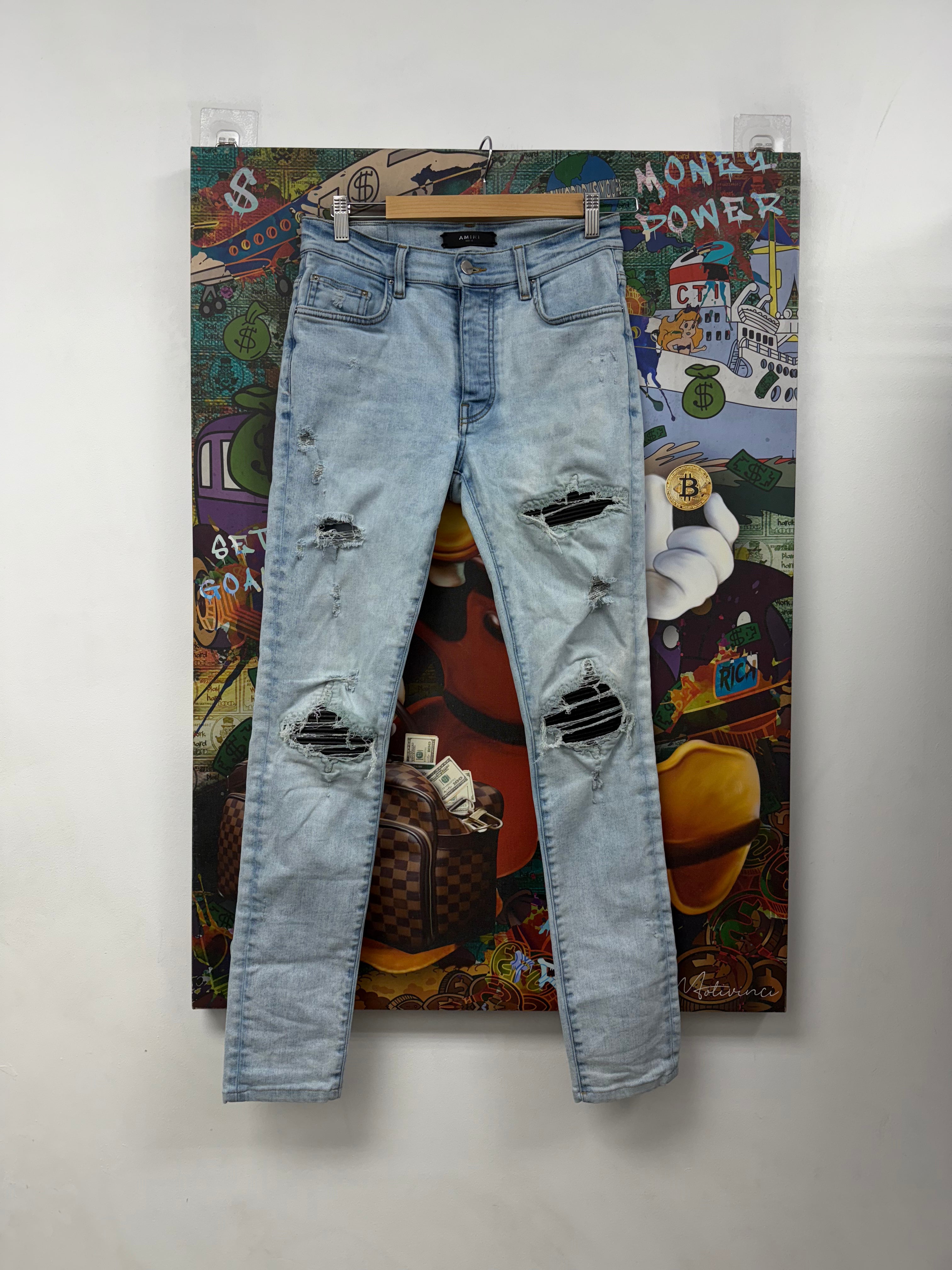 Amiri MX1 Light Wash Black Leather Patch Jeans