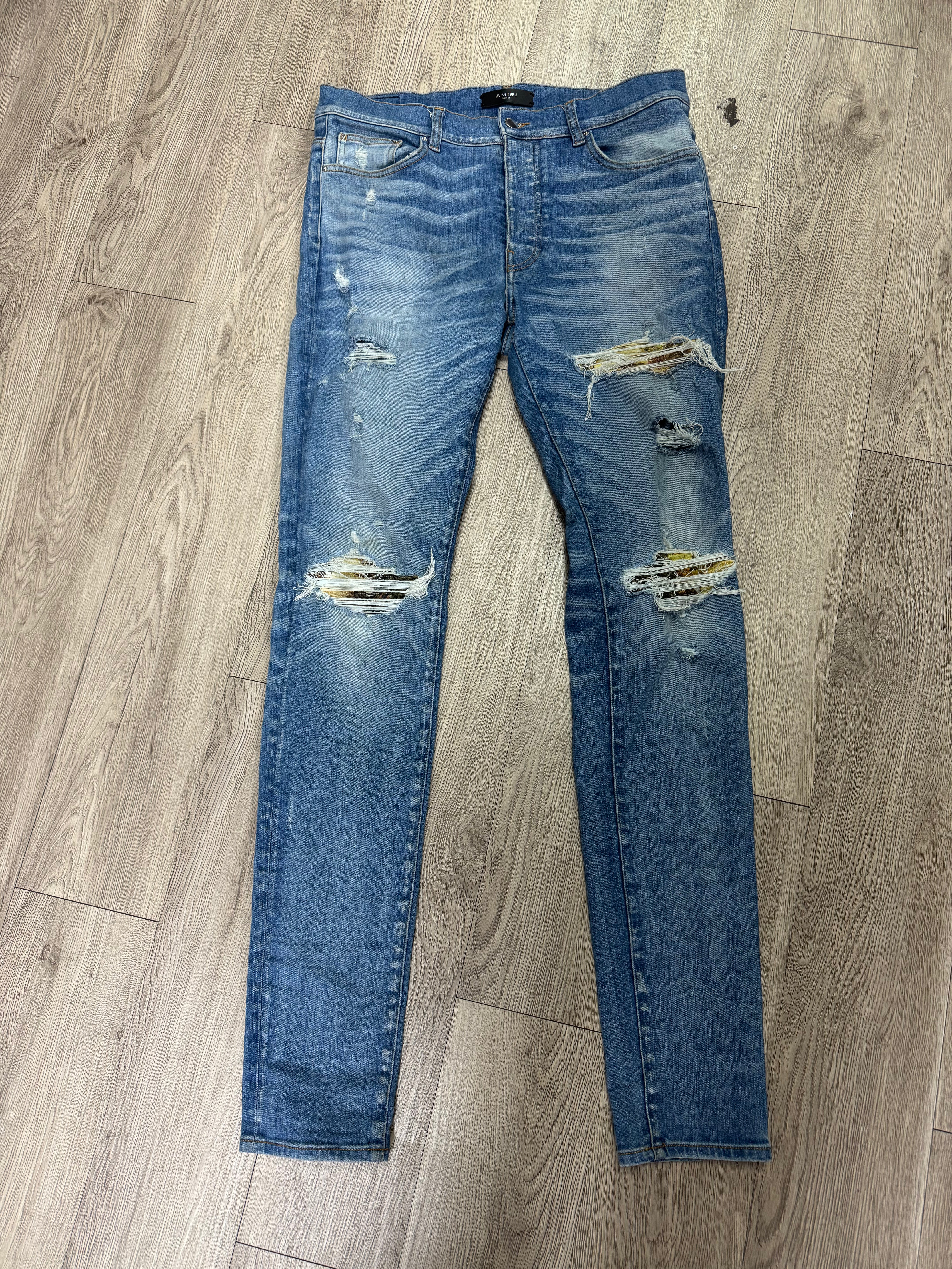 Amiri MX1 Light Wash Aloha Patch Jeans