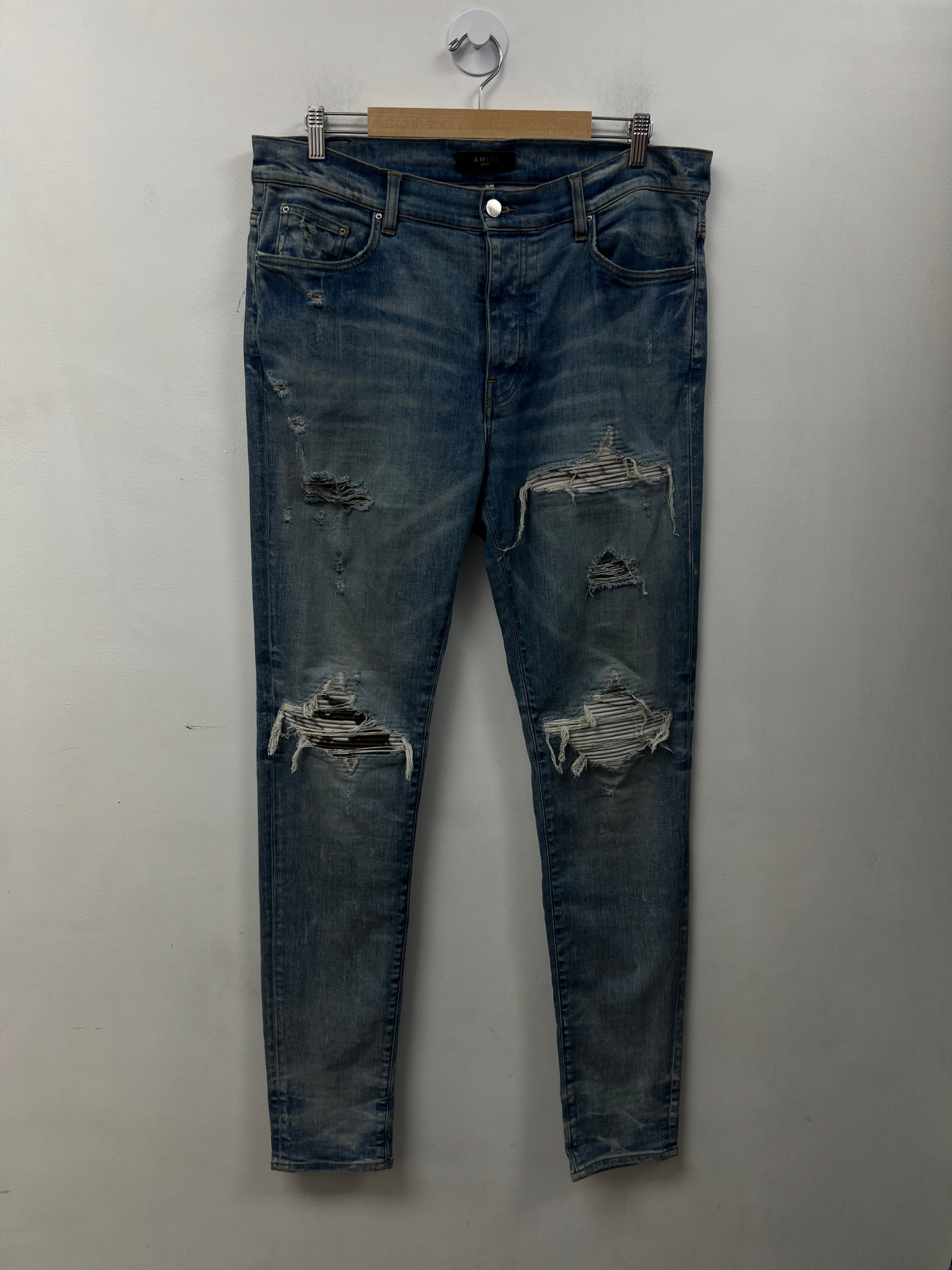 Amiri MX1 Light Wash Marble Patch Jeans