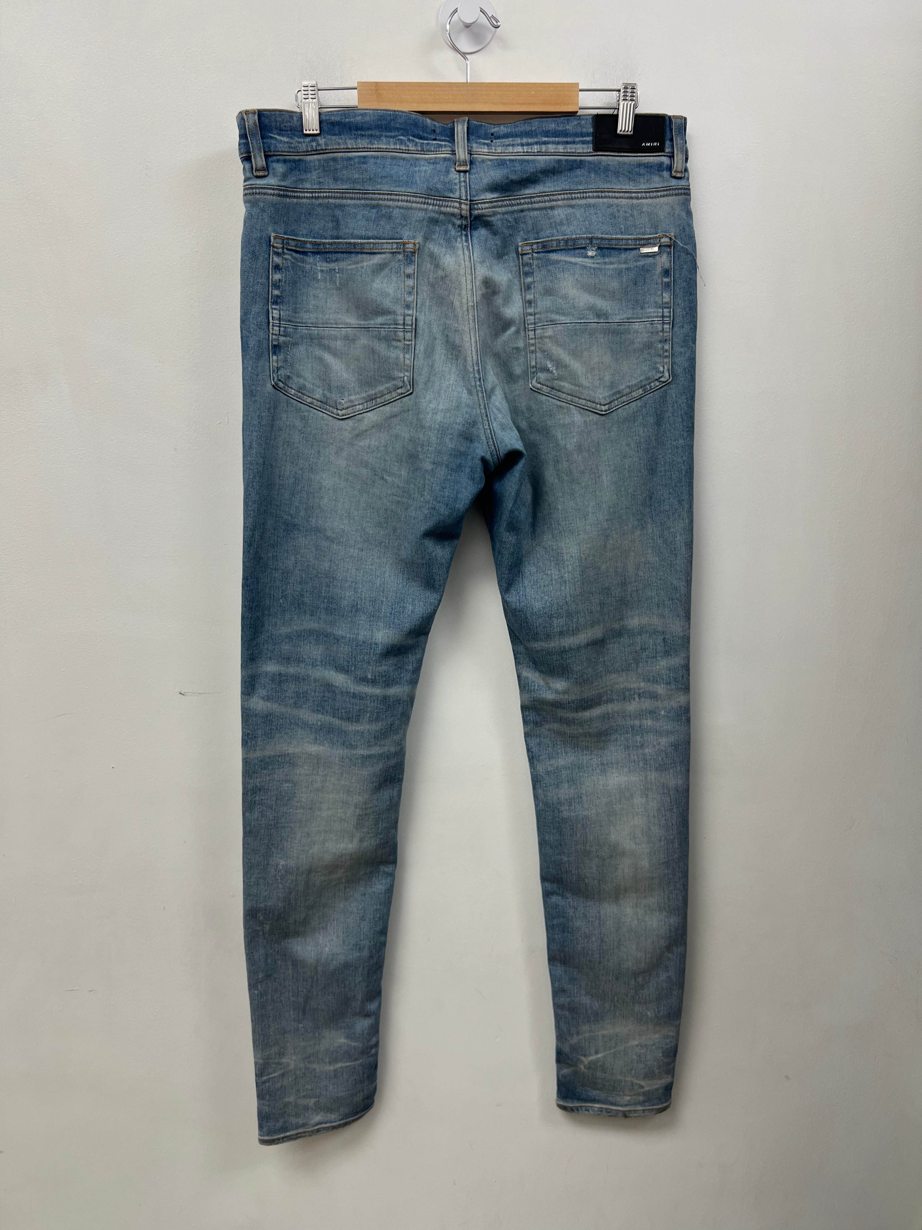 Amiri MX1 Light Wash Marble Patch Jeans
