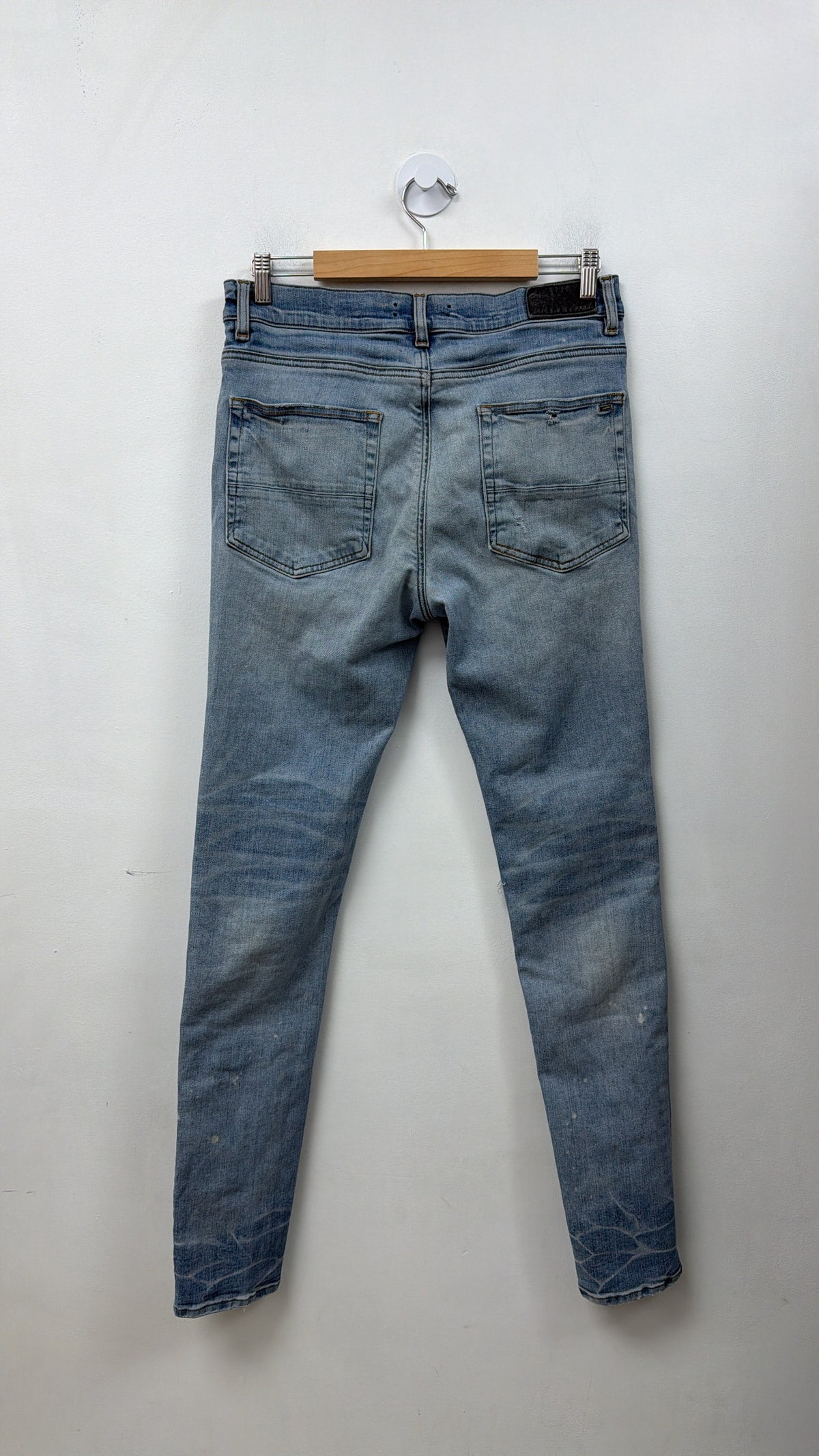 Amiri MX1 Light Wash Playboy Patch Jeans