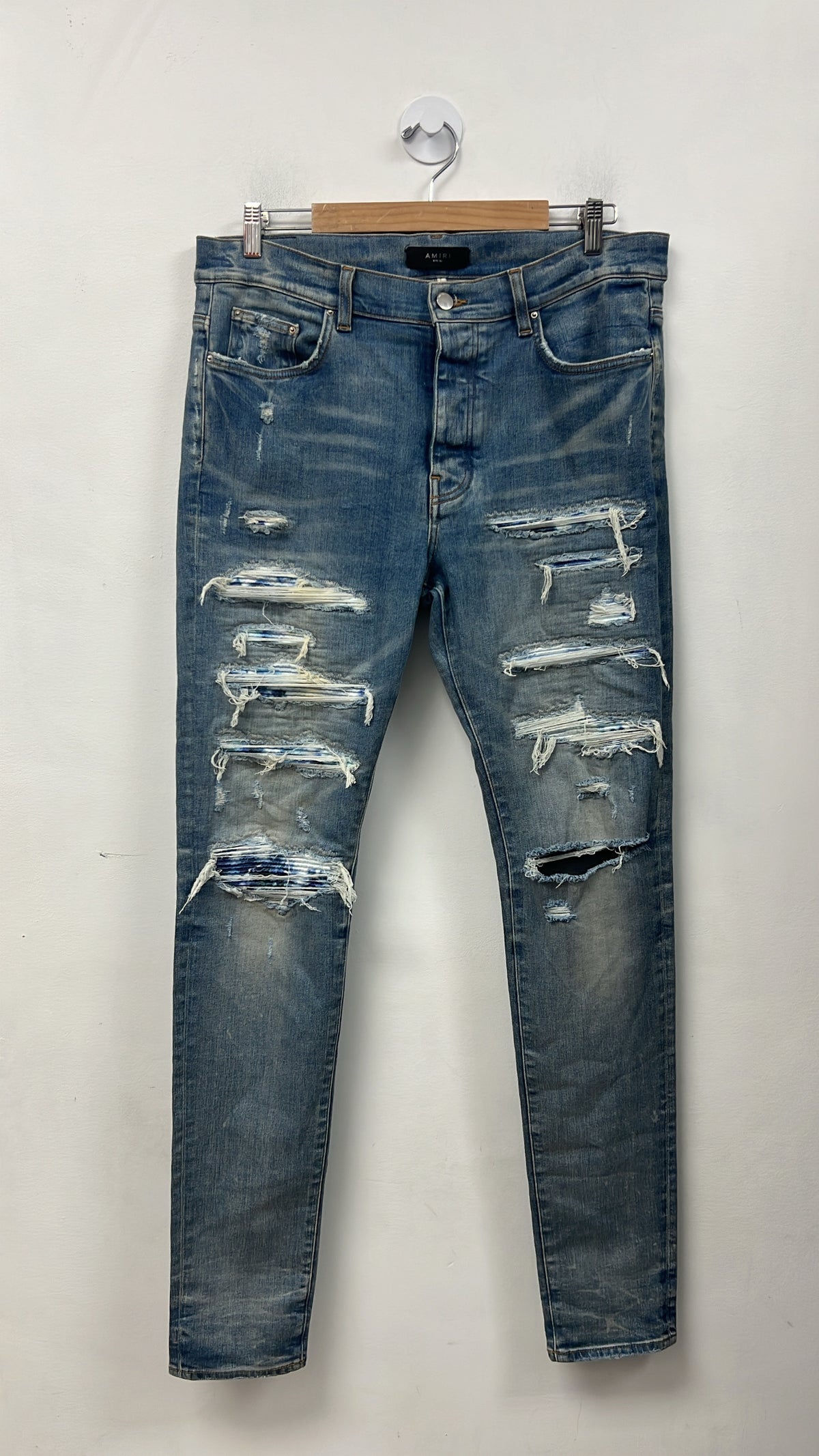 Amiri Light Wash Blue Tie Dye Thrasher Patch Jeans