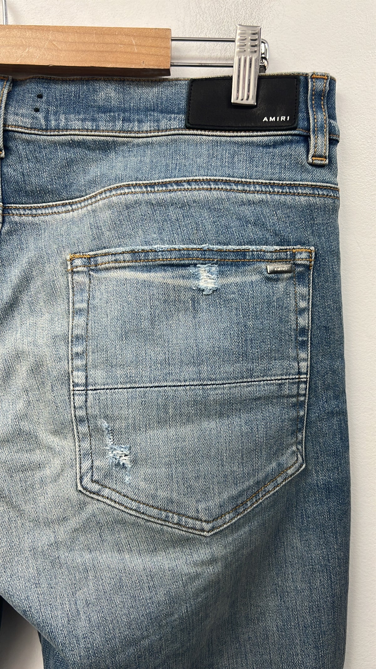 Amiri Light Wash Blue Tie Dye Thrasher Patch Jeans