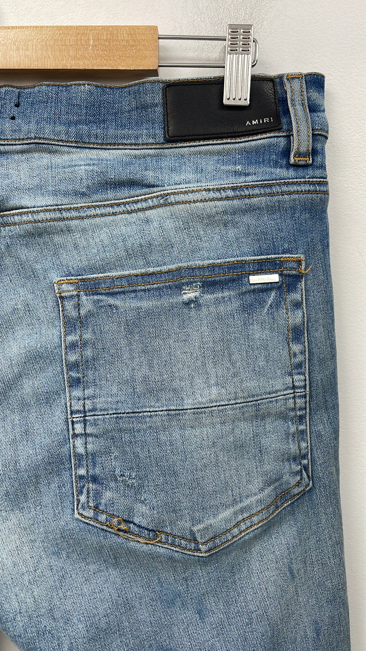 Amiri MX1 Light Wash Black Suede Patch Jeans