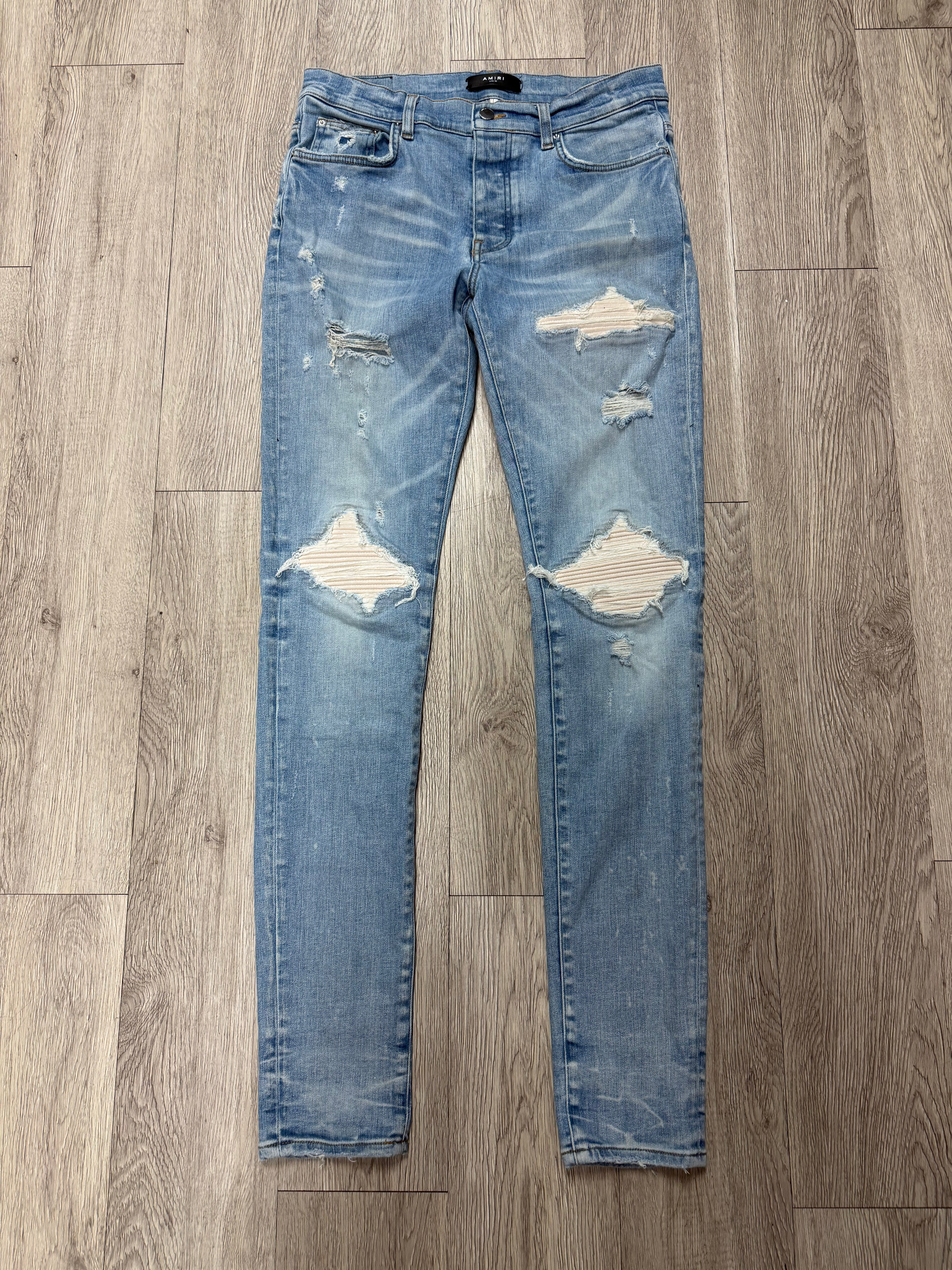 Amiri MX1 Light Wash White Patch Jeans
