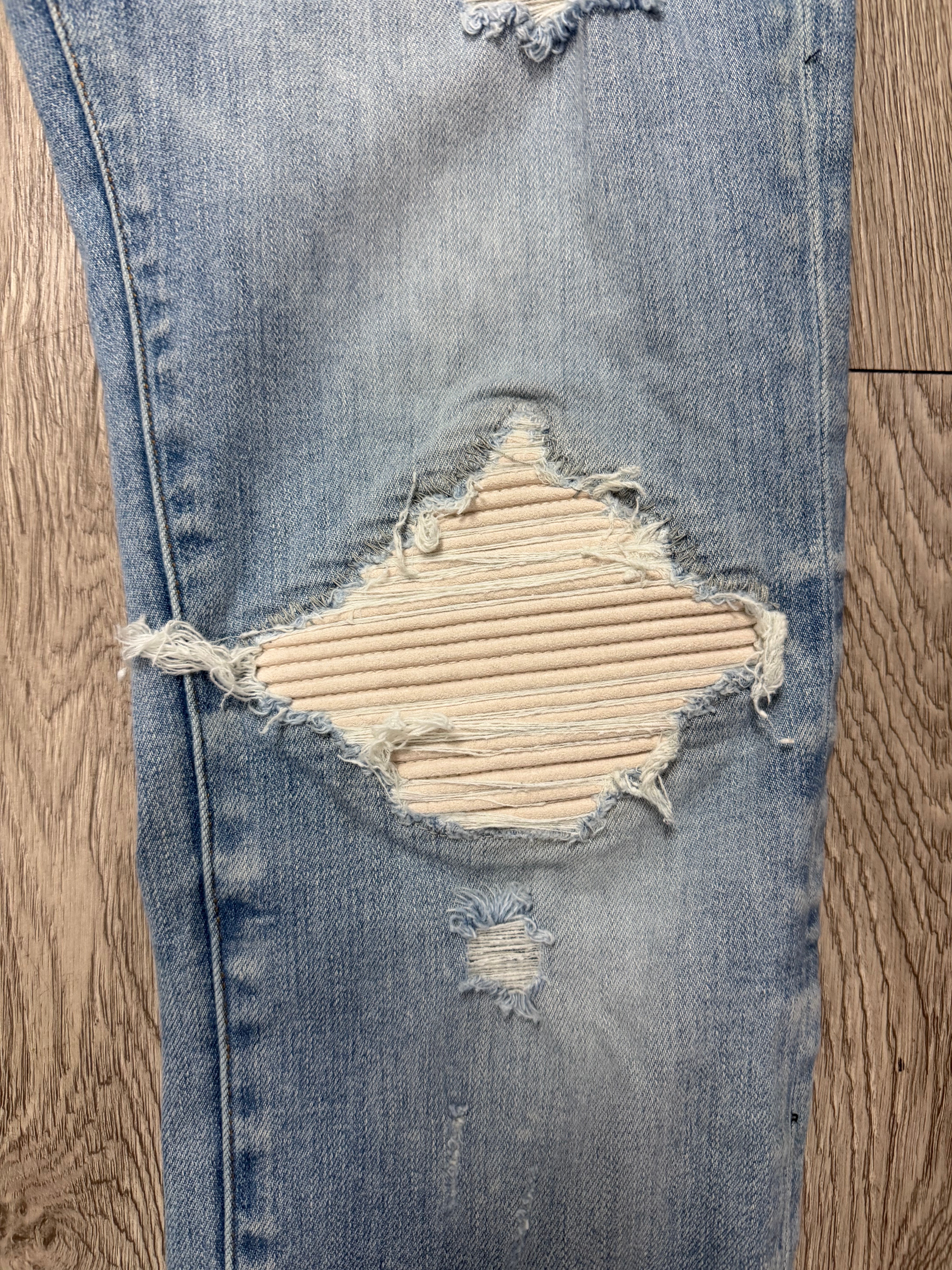 Amiri MX1 Light Wash White Patch Jeans