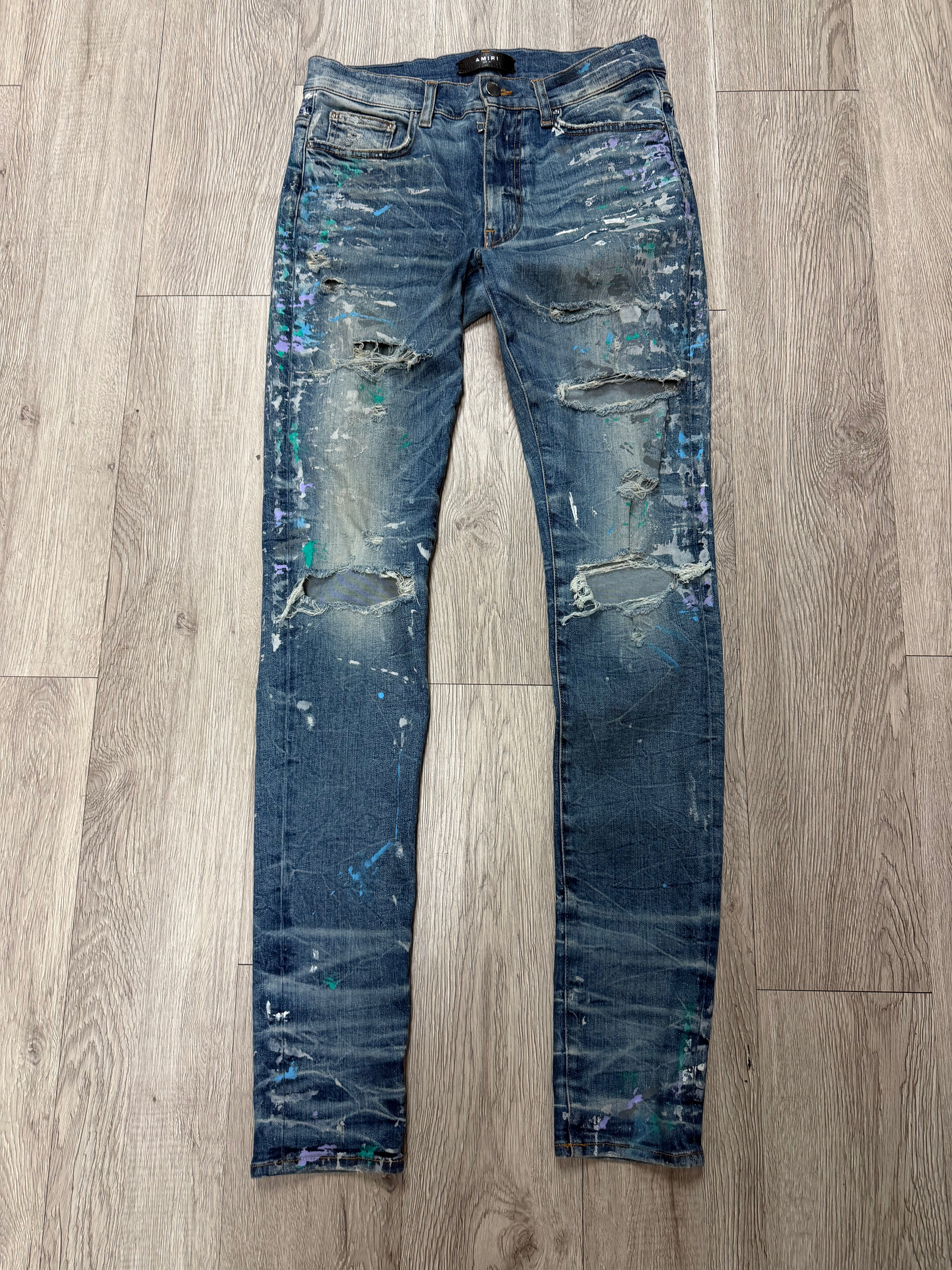 Amiri Light Wash Paint Splatter Jeans