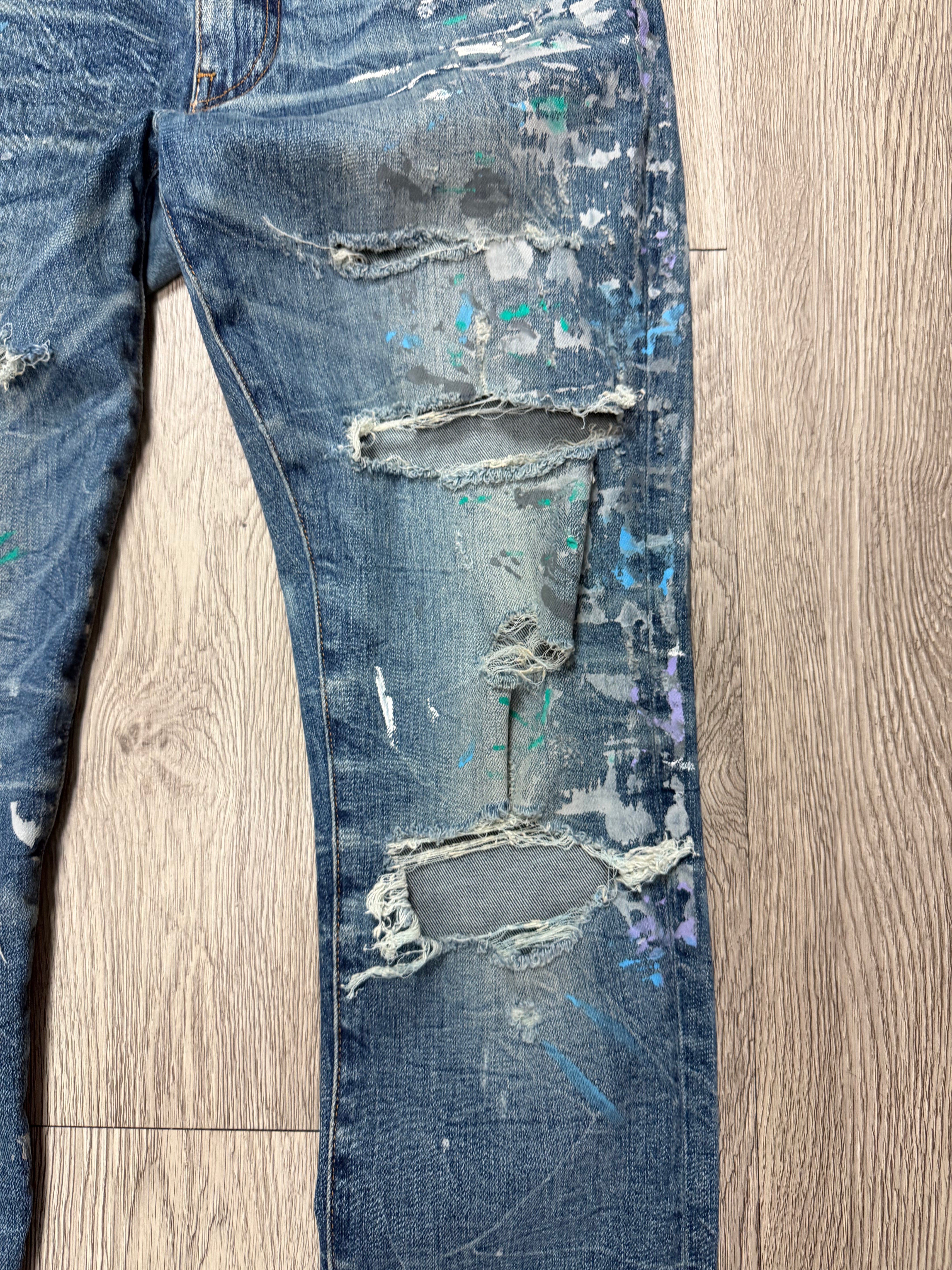 Amiri Light Wash Paint Splatter Jeans