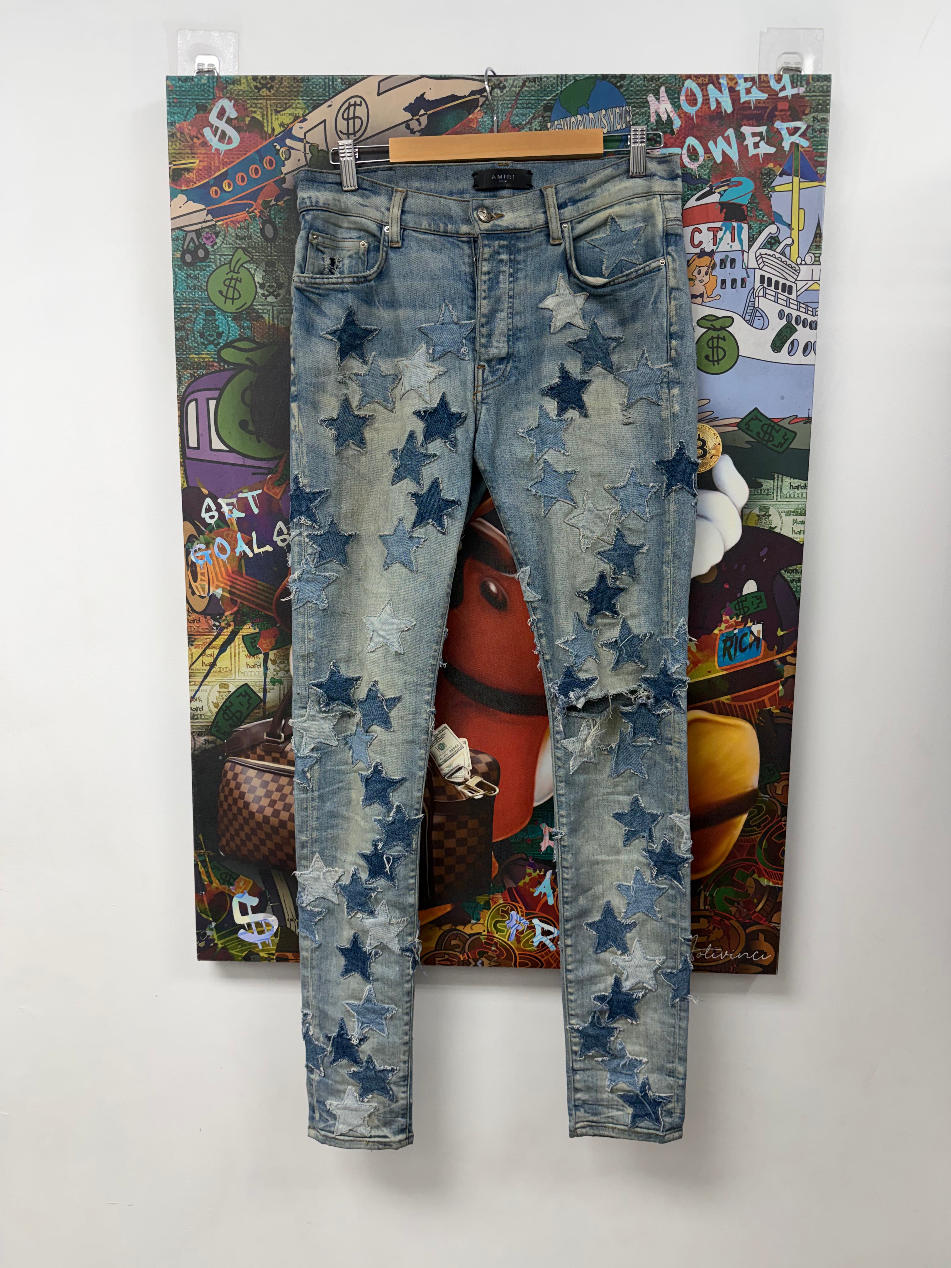 Amiri Light Wash Denim Chemist Stars Jeans