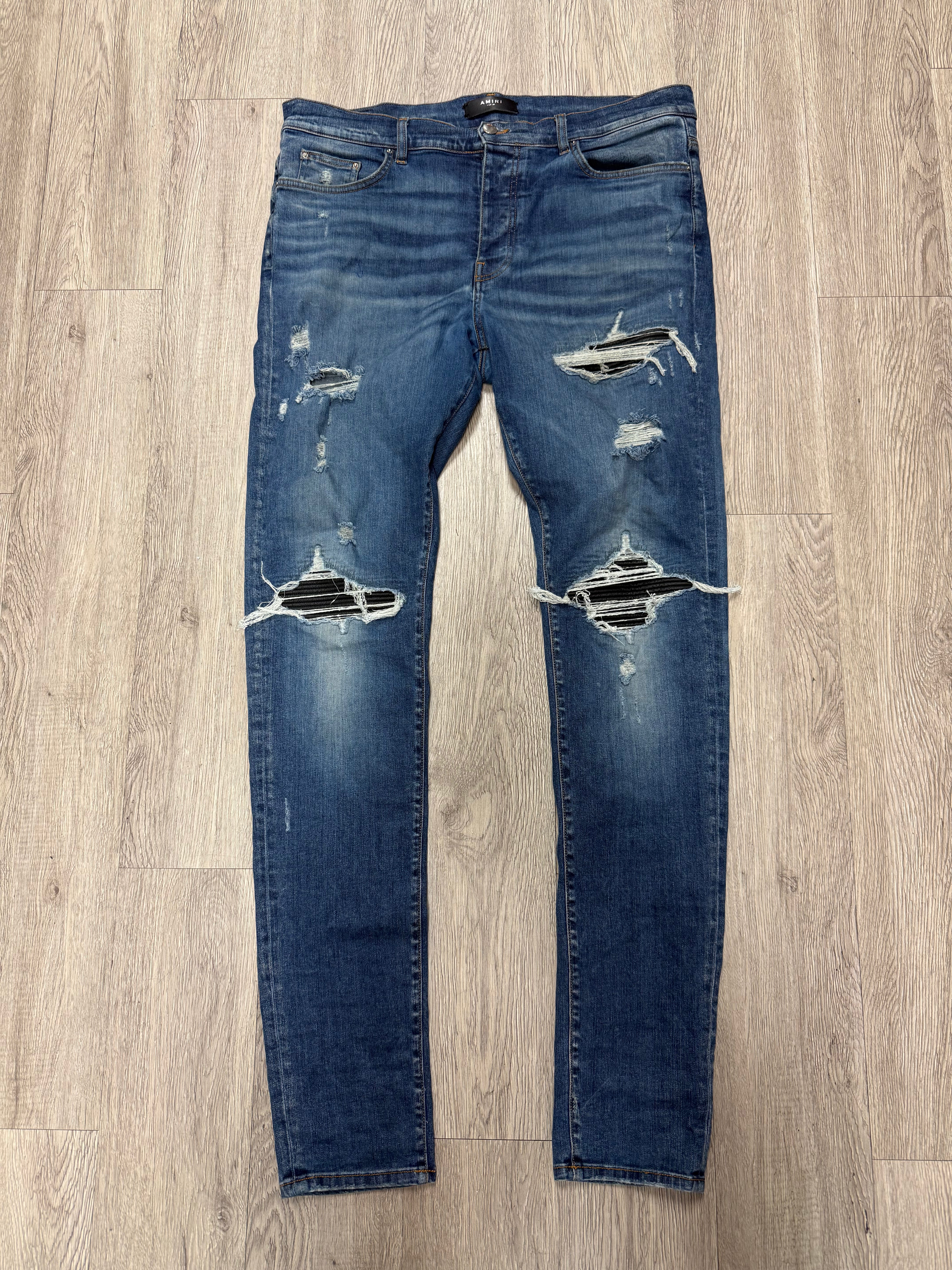Amiri MX1 Light Wash Black Patch Jeans