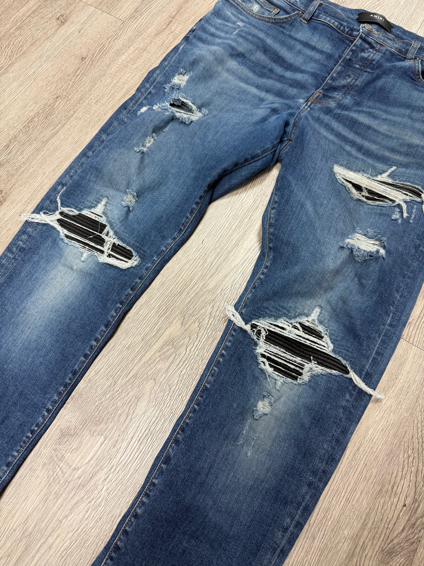Amiri MX1 Light Wash Black Patch Jeans