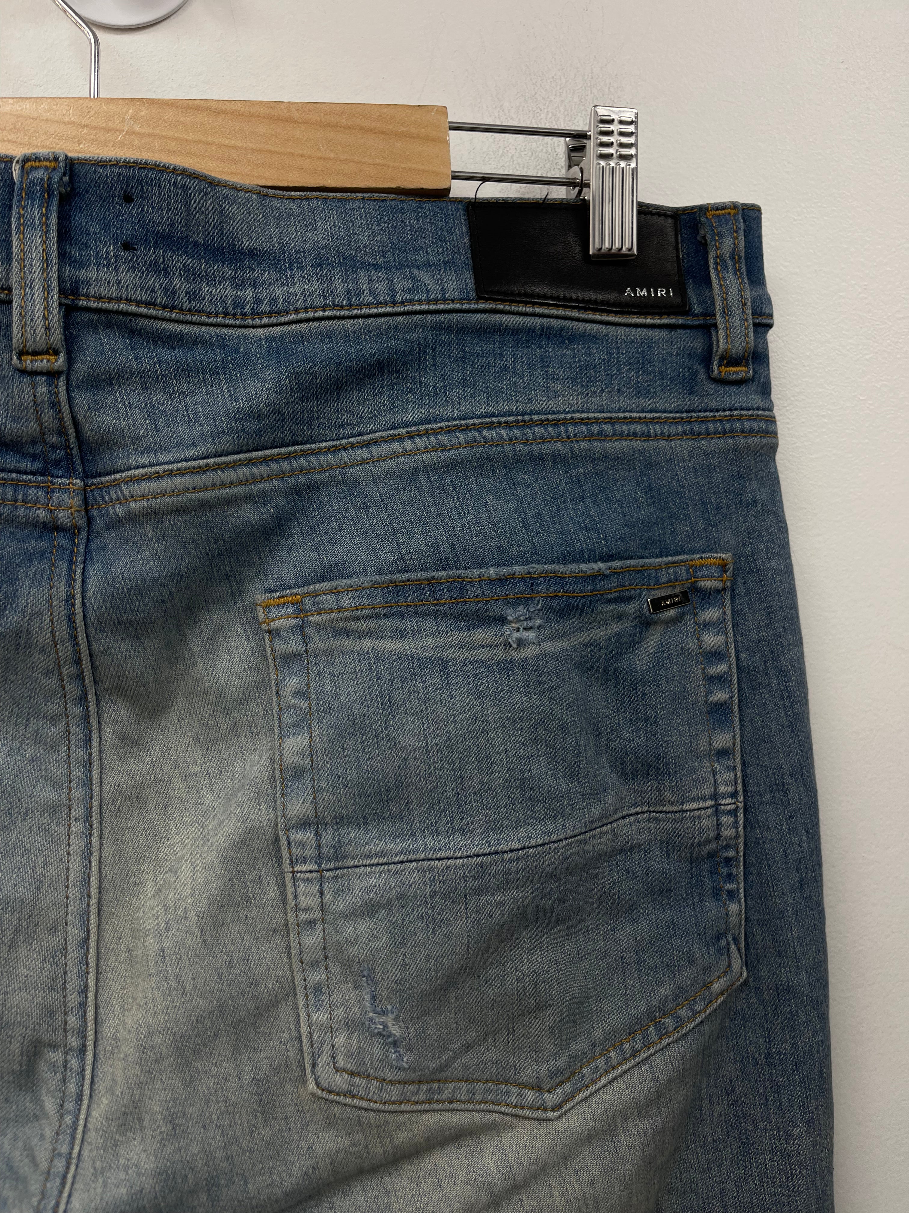 Amiri MX1 Light Wash Brown Patch Jeans
