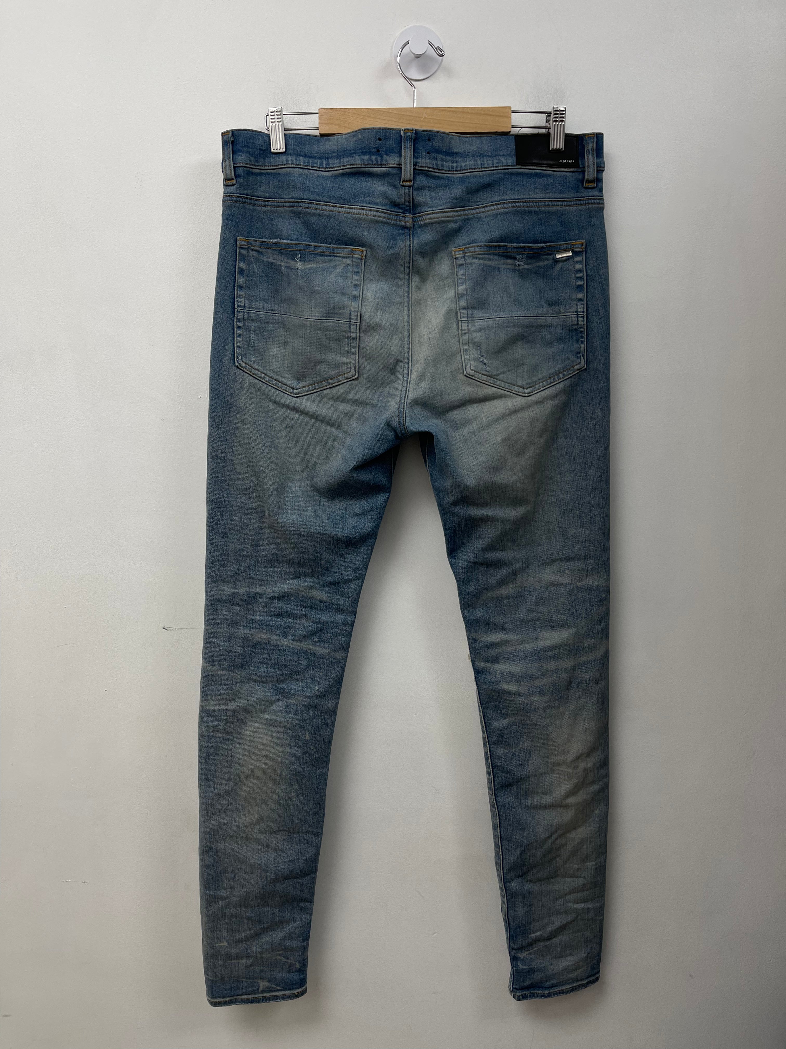 Amiri MX1 Light Wash Brown Patch Jeans