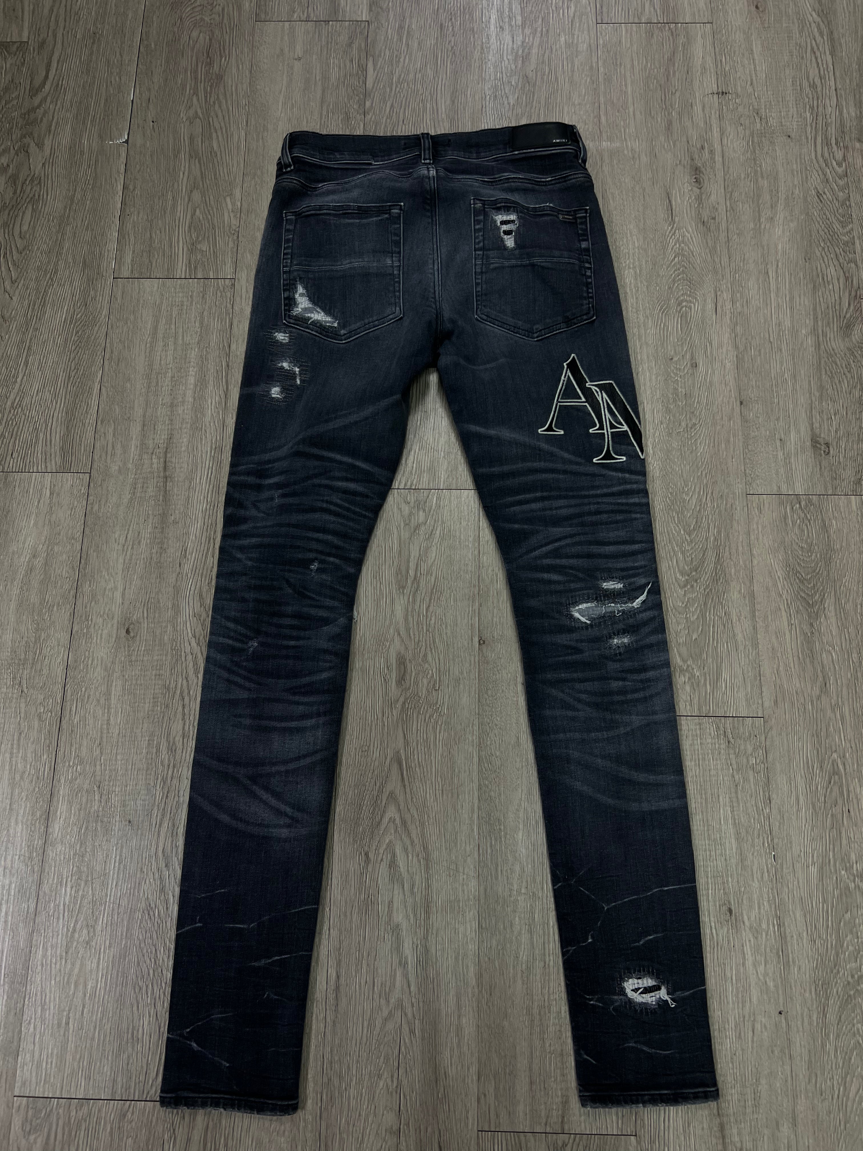 Amiri Grey Distressed Staggered Side Logo Jeans