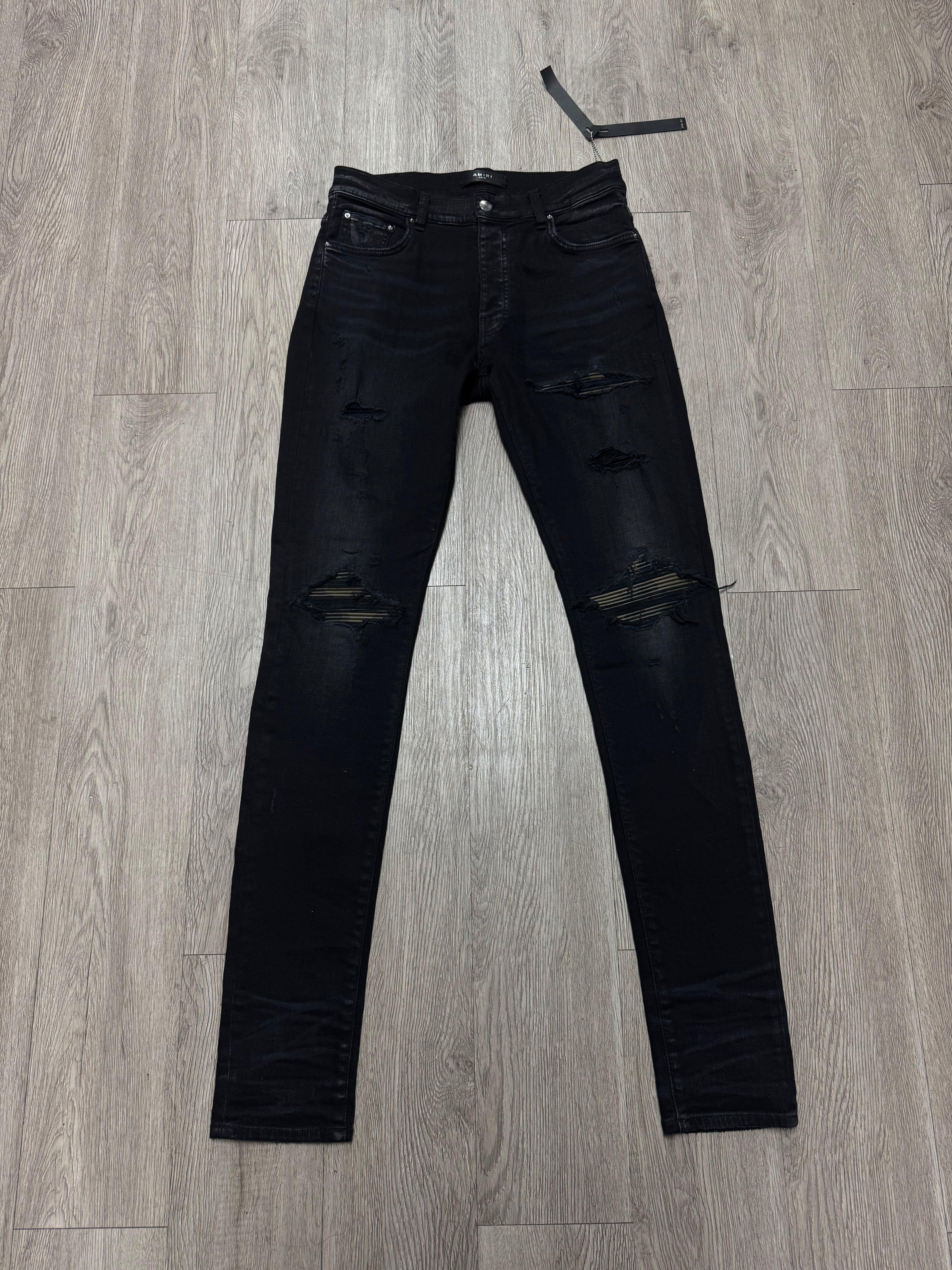 Amiri MX1 Black Wash Camo Leather Patch Jeans
