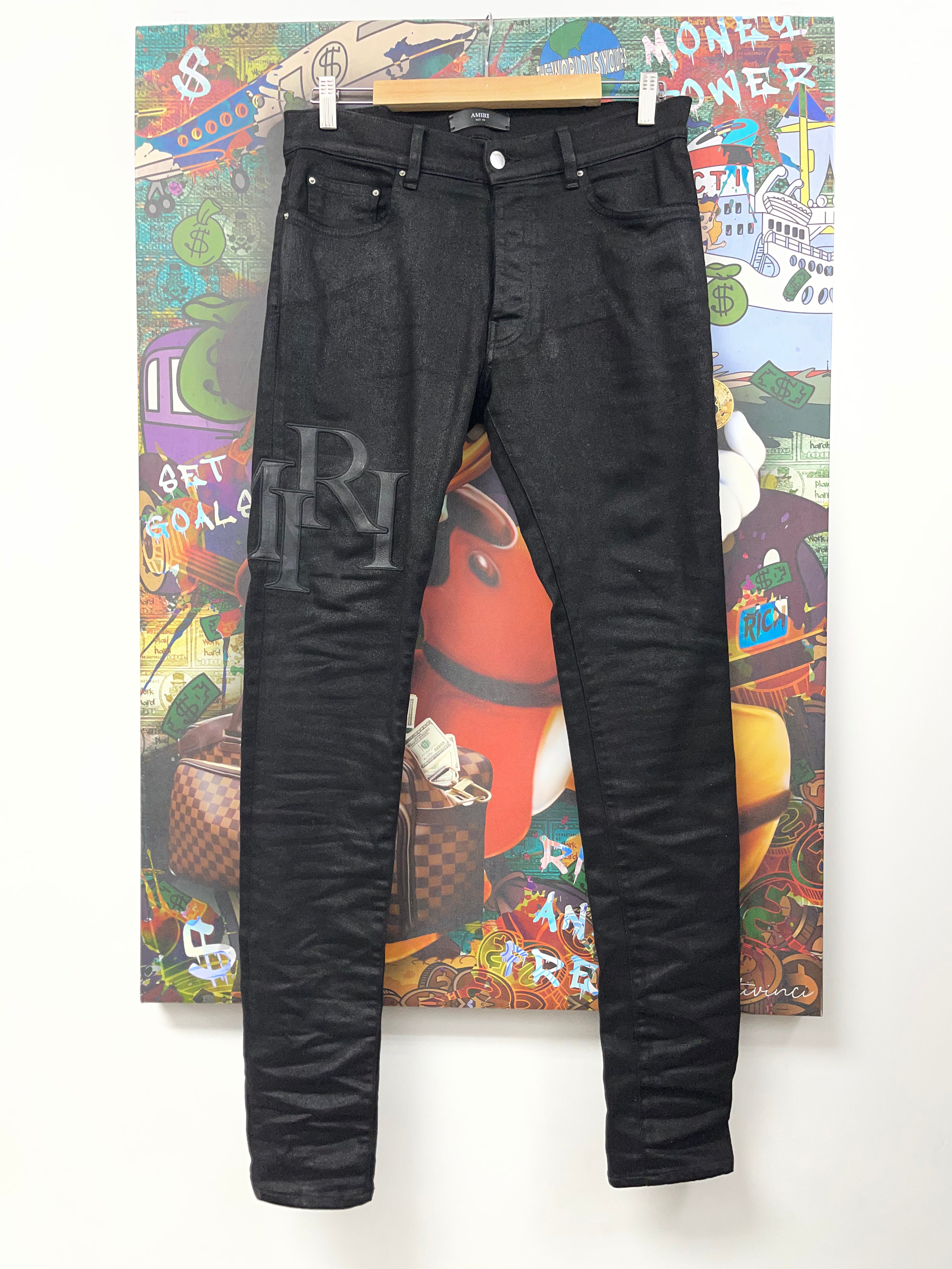 Amiri Black Wax Staggered Side Logo Jeans