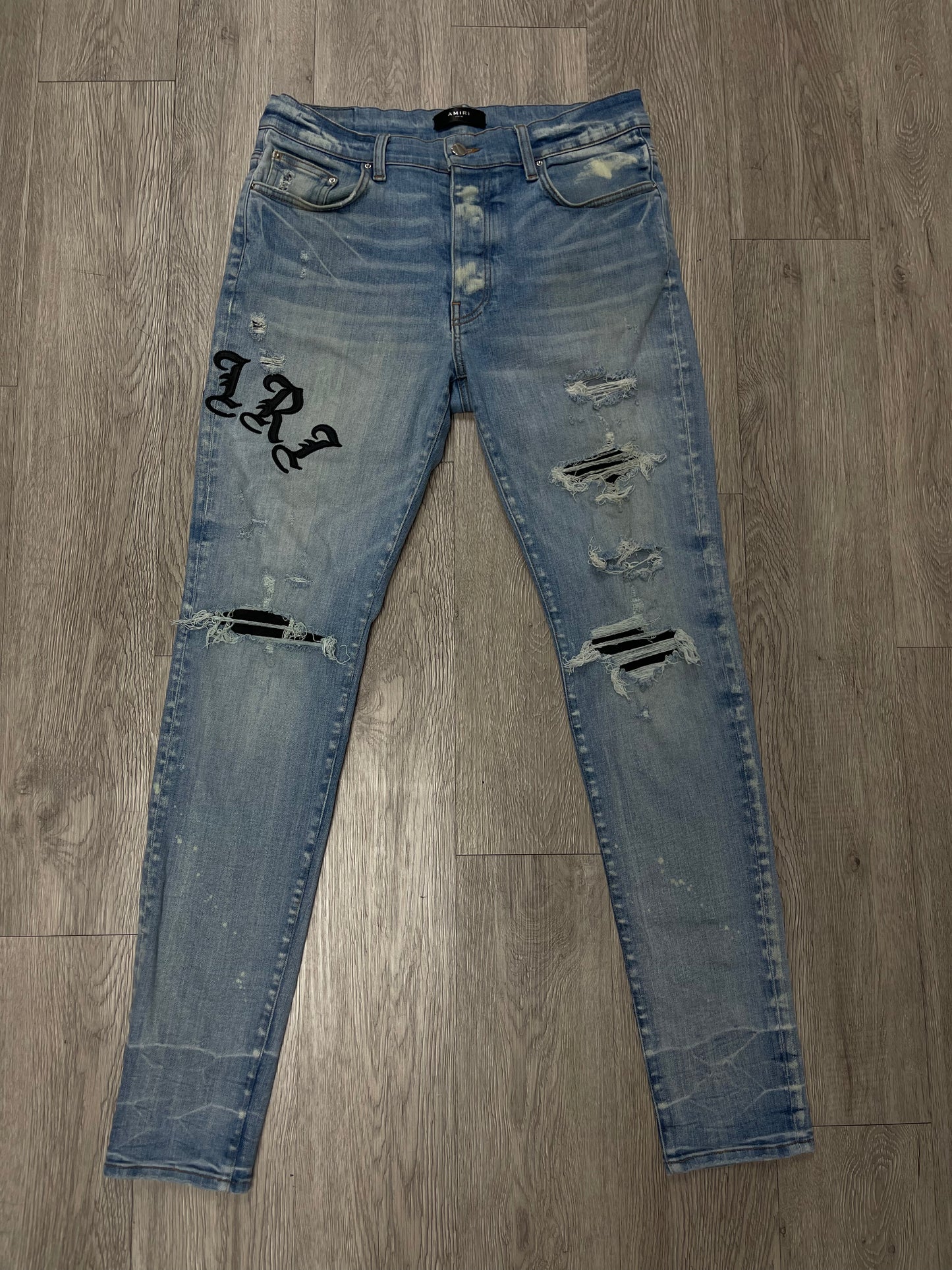 Amiri Light Wash Old English Jeans