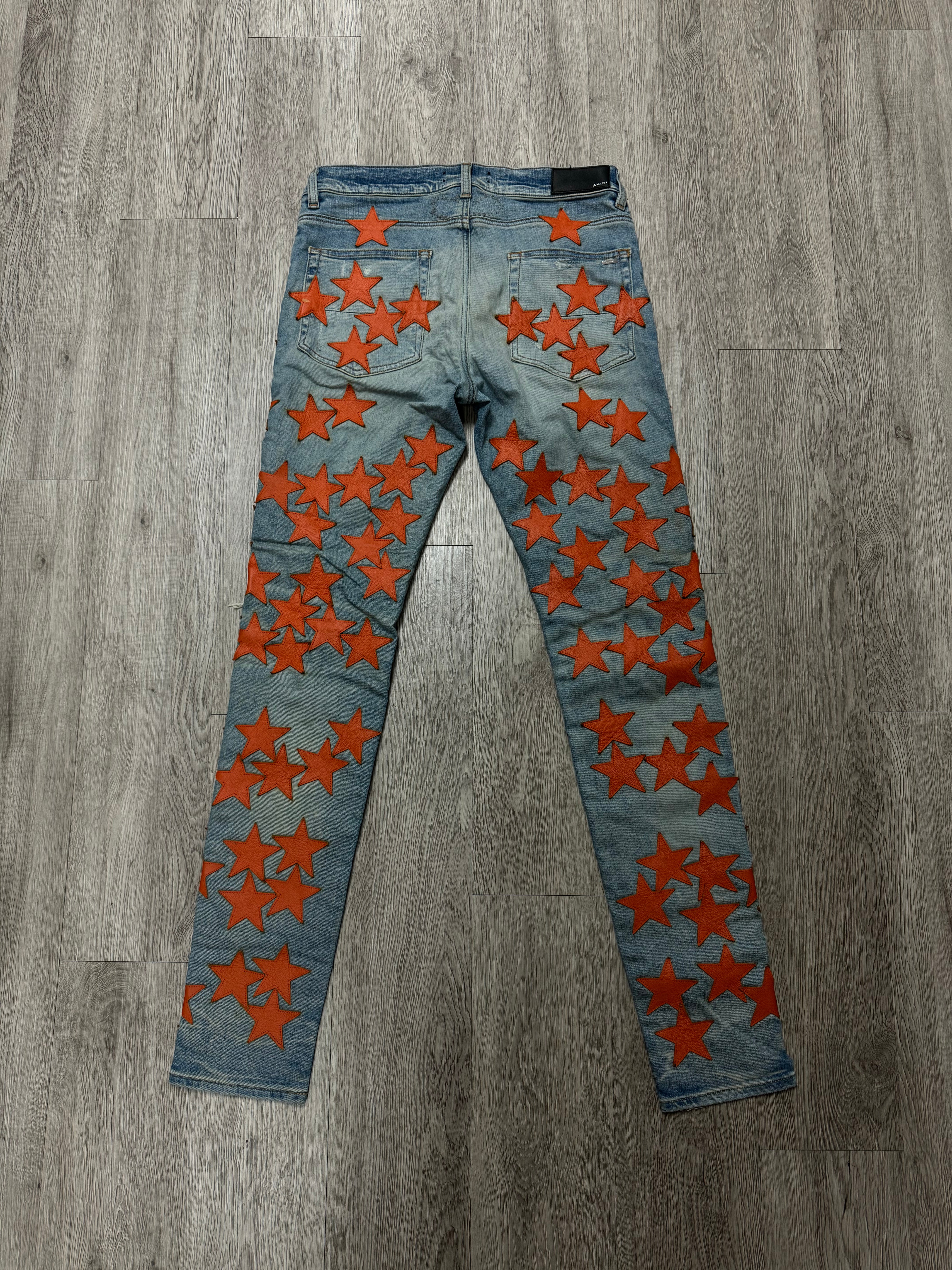 Amiri Chemsit Jeans Light Wash Orange Stars Used