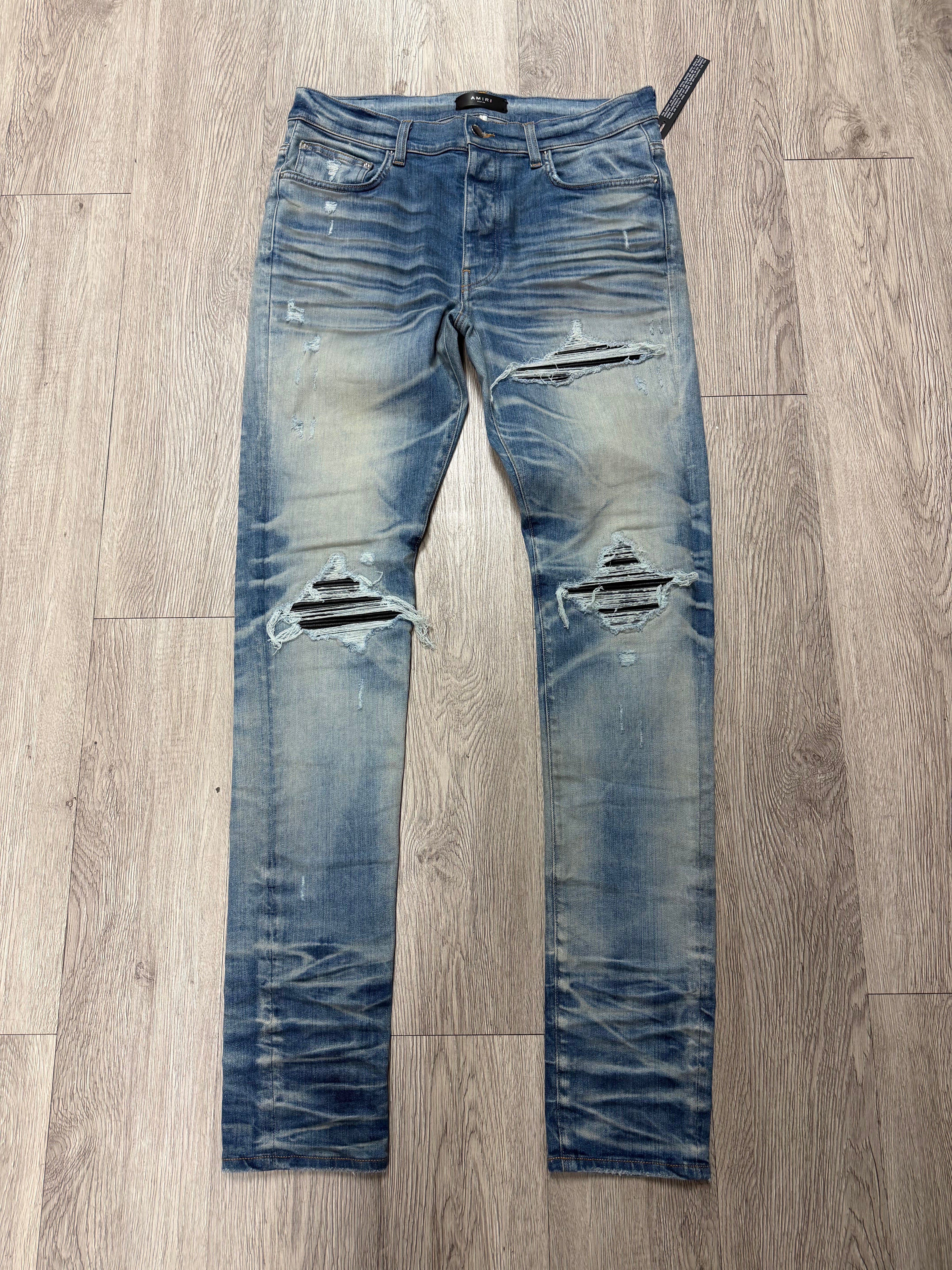 Amiri MX1 Light Wash Black Patch Jeans