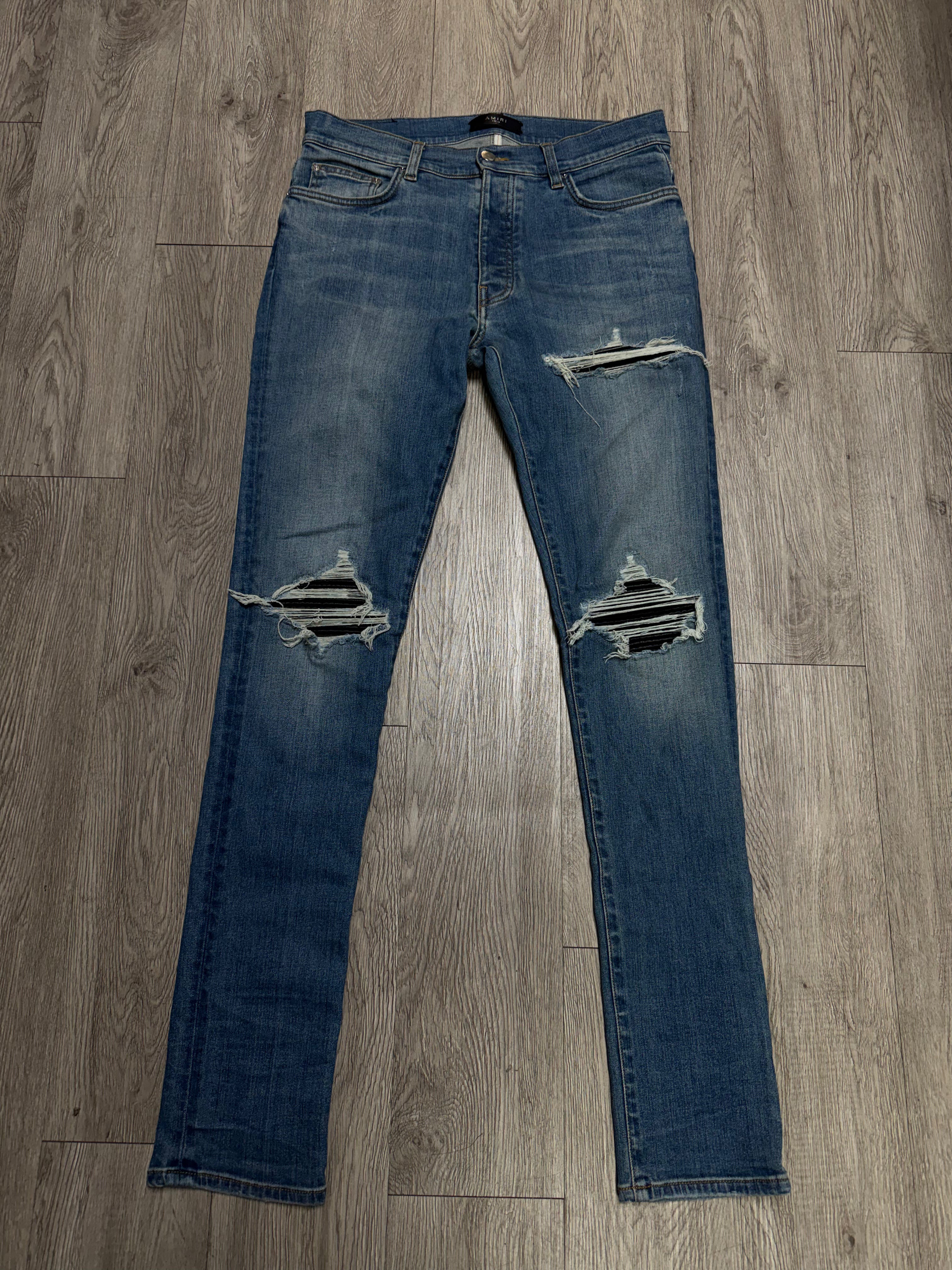 Amiri Light Wash Black Patch MX1 Jeans