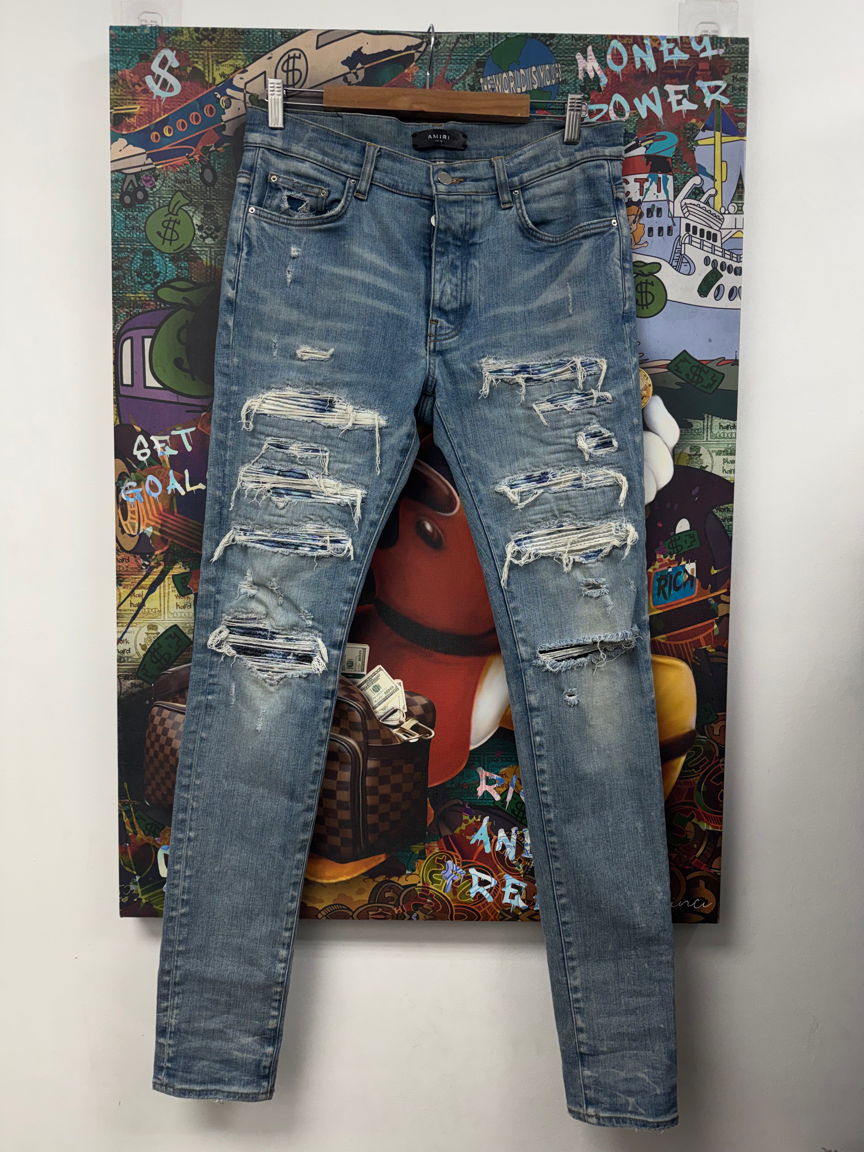 Amiri Light Wash Tie Dye Thrasher Patch Jeans